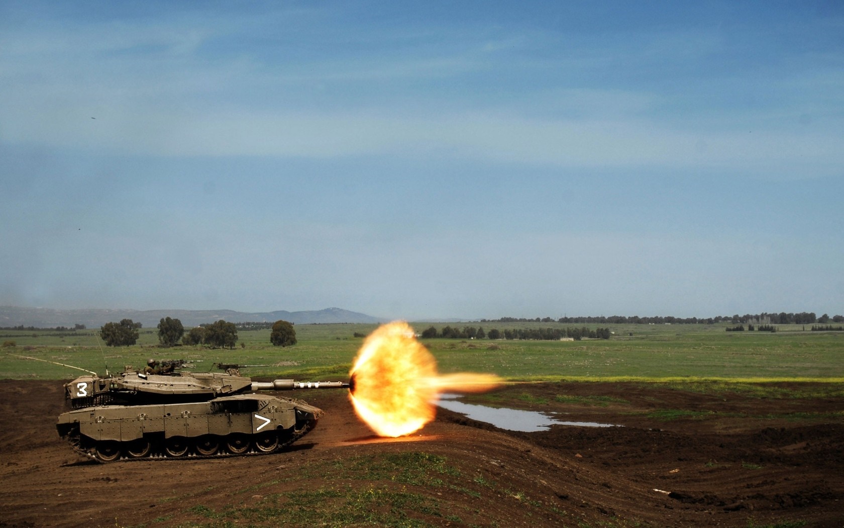 Merkava tank firing in a field HD Wallpaper