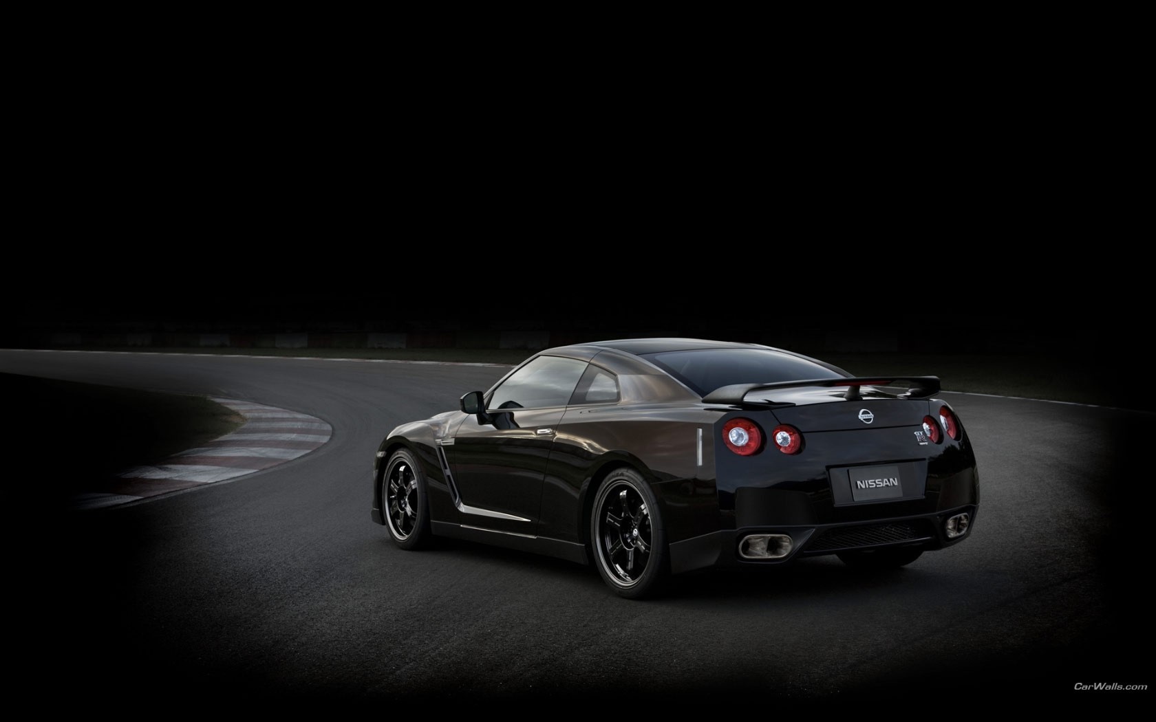 Black Nissan GT-R on a race track HD Wallpaper