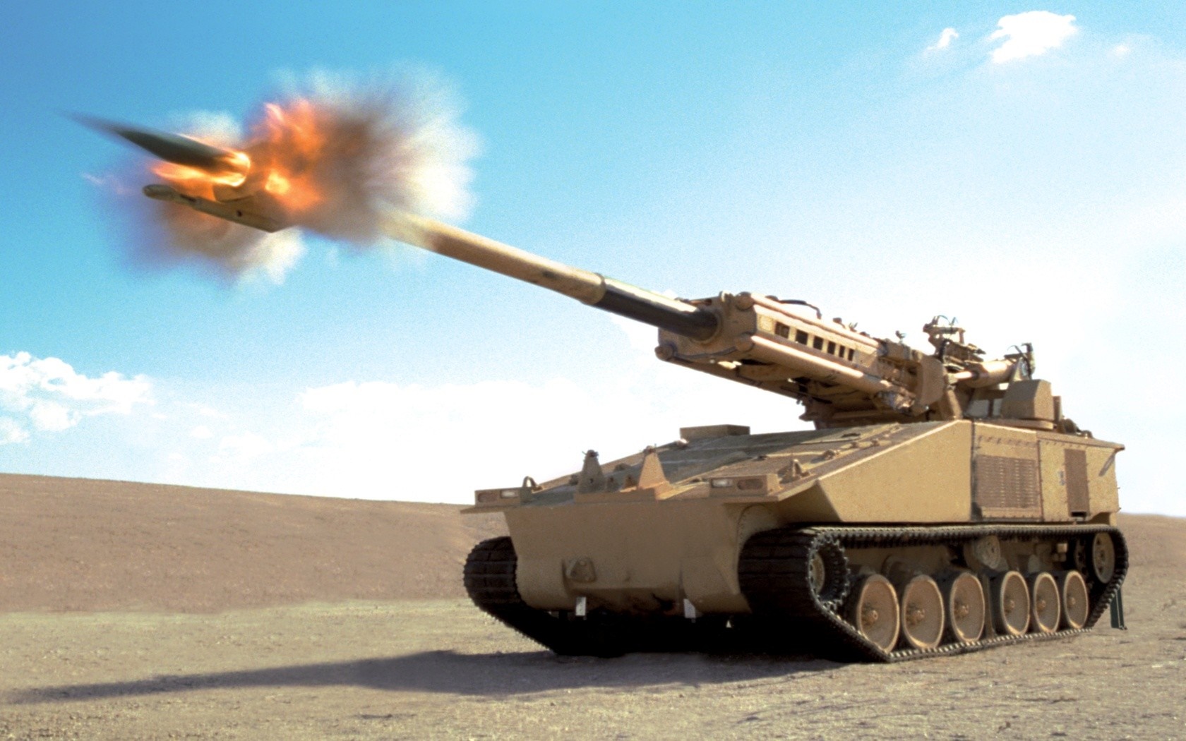 Tank firing a missile in a desert landscape HD Wallpaper
