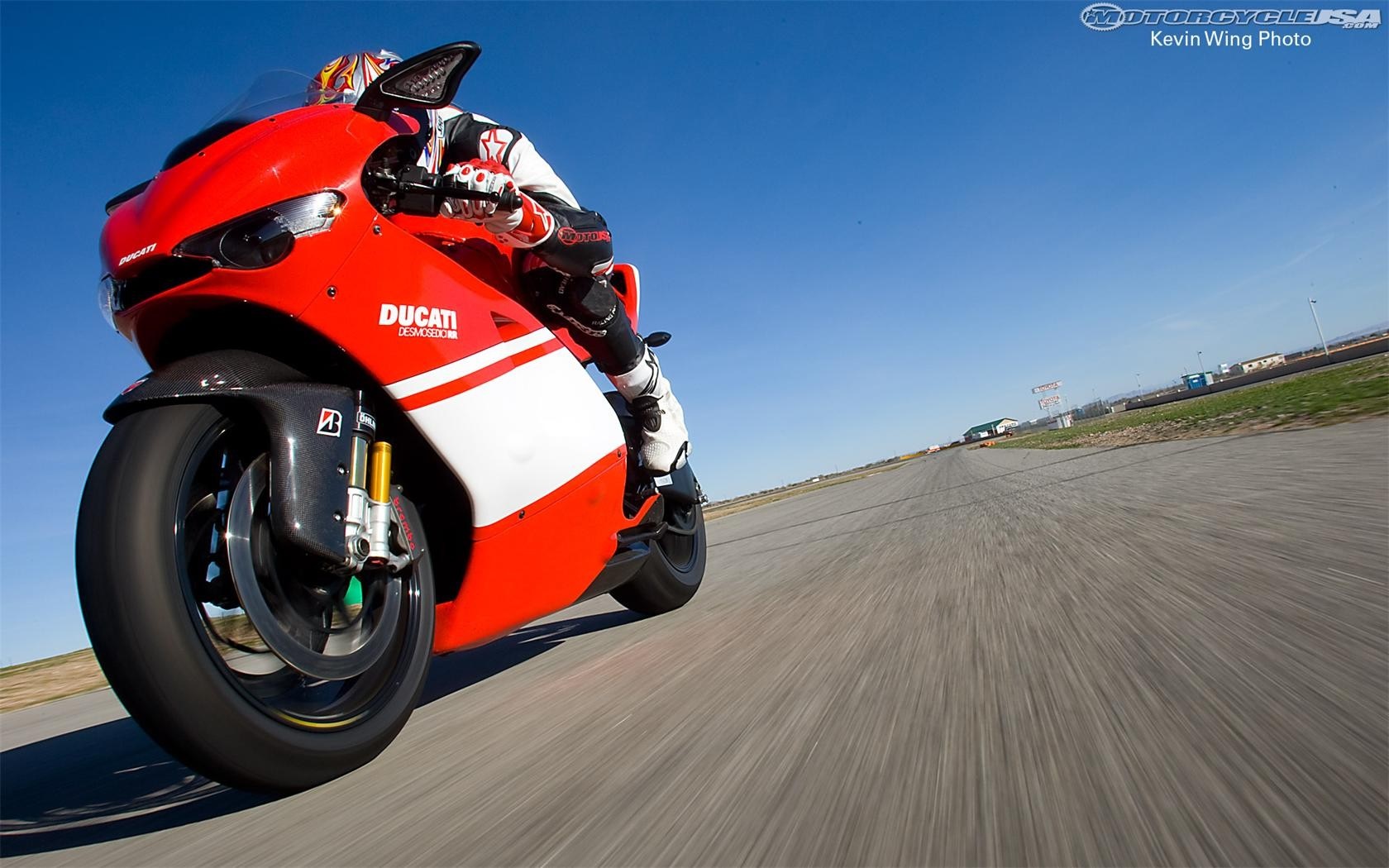 Ducati motorcycle on a race track HD Wallpaper