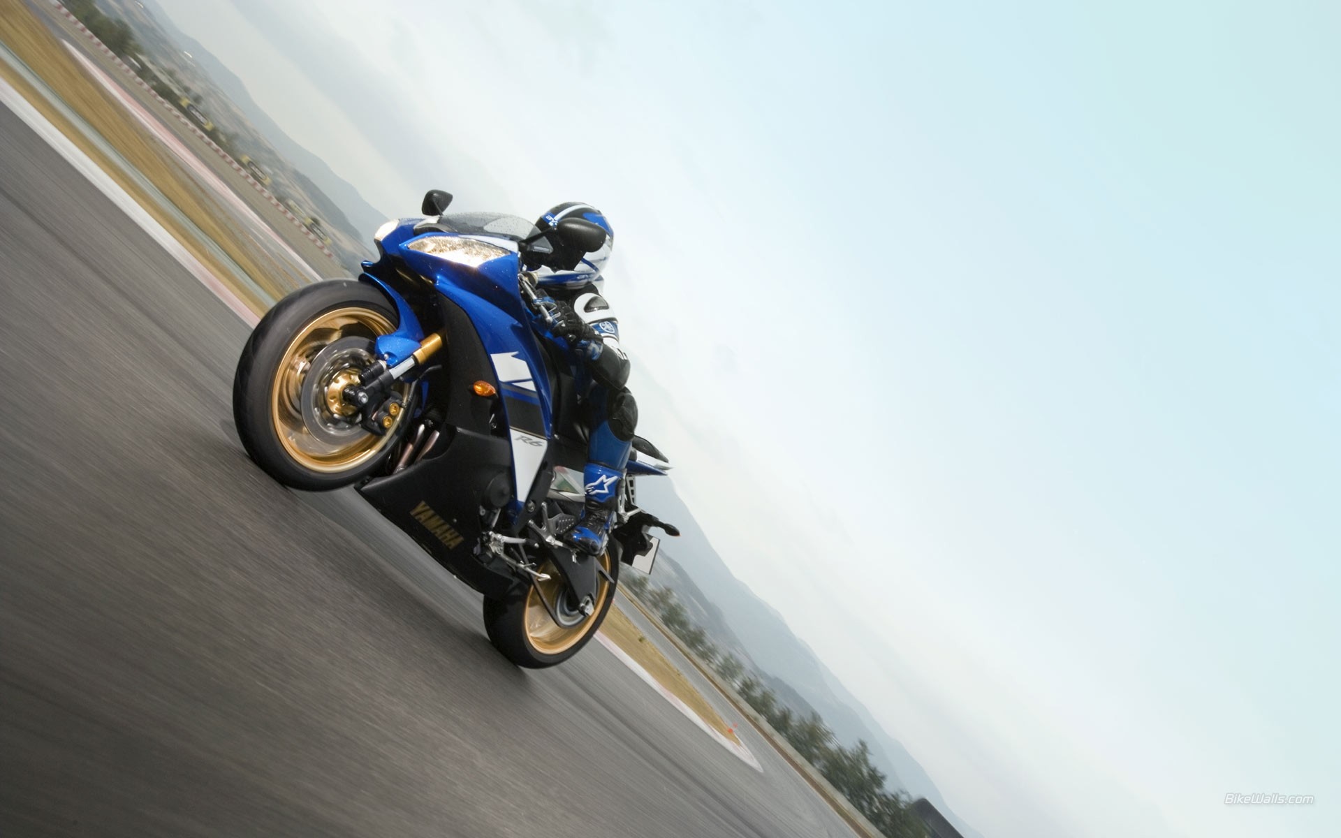 Yamaha R6 motorcycle rider on a race track HD Wallpaper