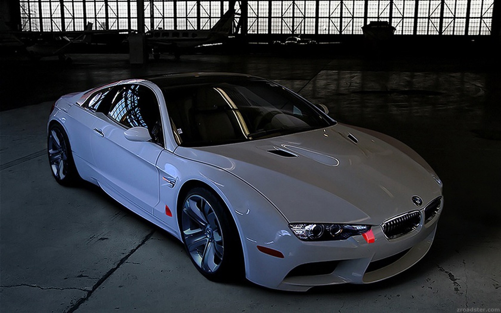 White BMW sports car in a hangar HD Wallpaper