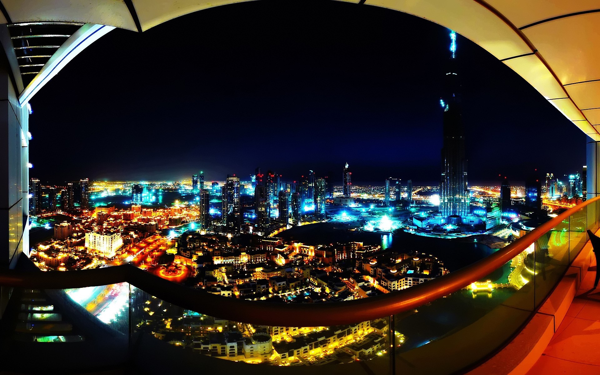 Cityscape at night with illuminated buildings and streets HD Wallpaper