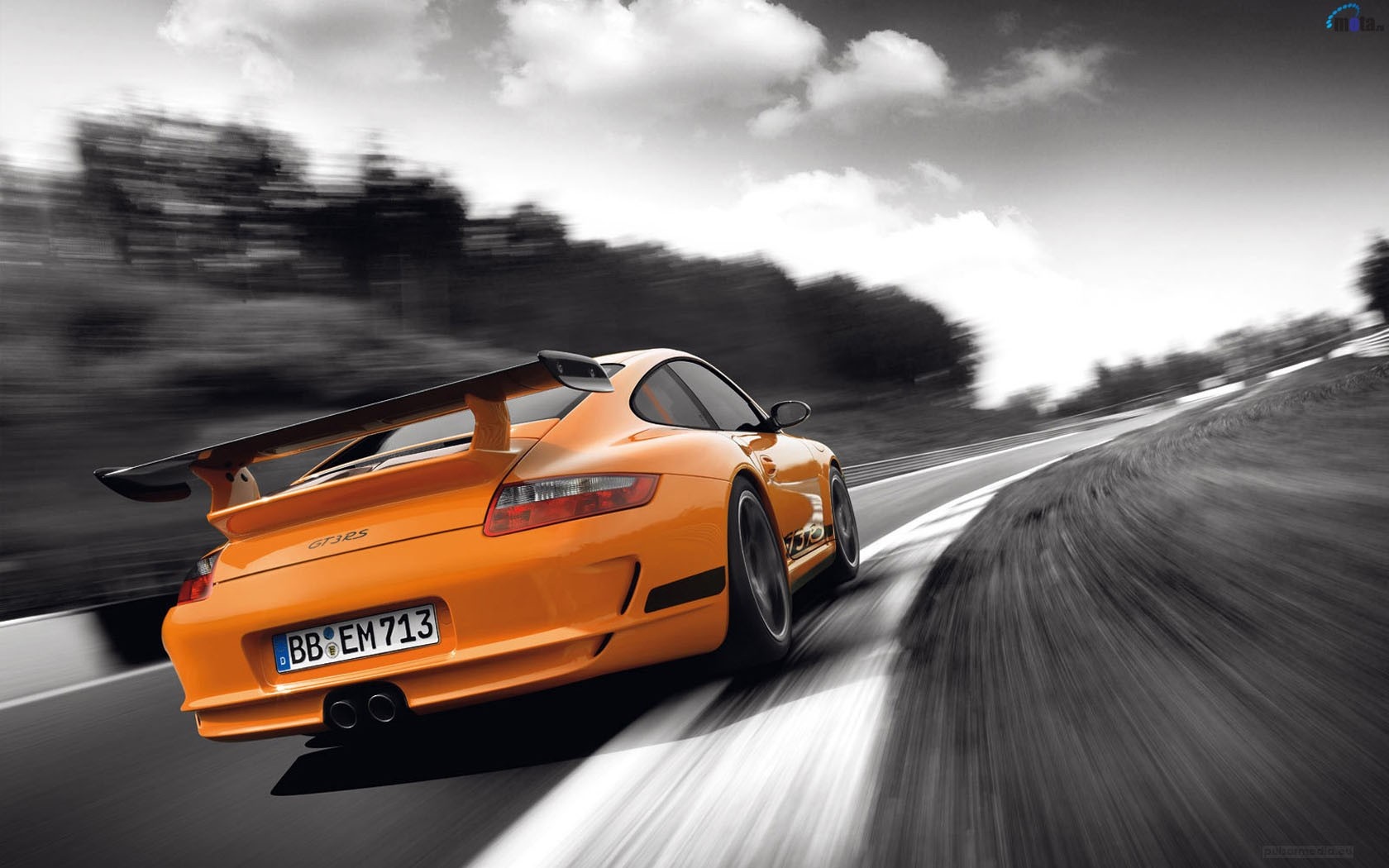Orange Porsche 911 GT3 RS driving on a track HD Wallpaper