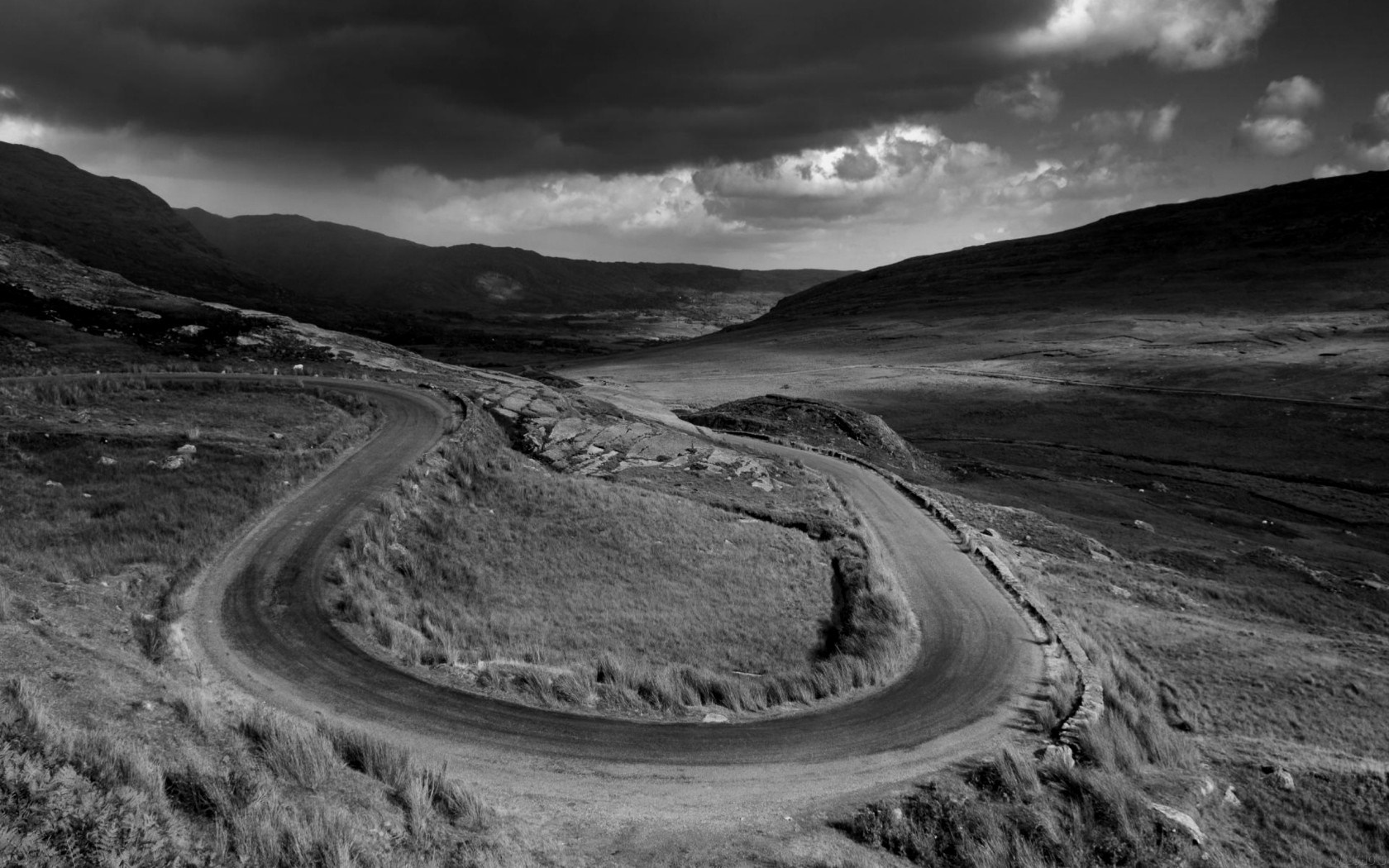 Monochrome landscape with hairpin turns on a mountain road HD Wallpaper