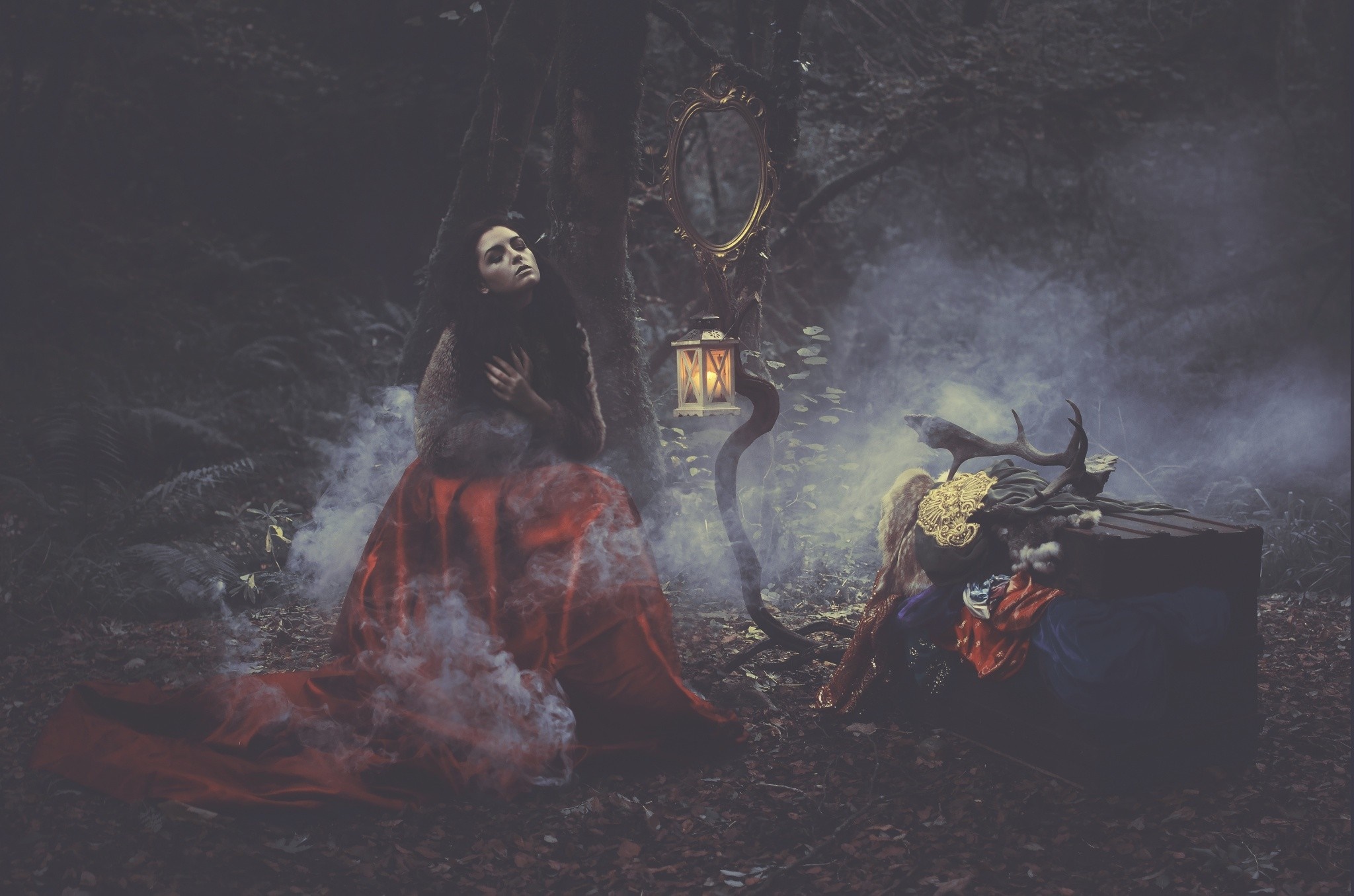 Woman in red dress in foggy forest with mirror and lantern HD Wallpaper
