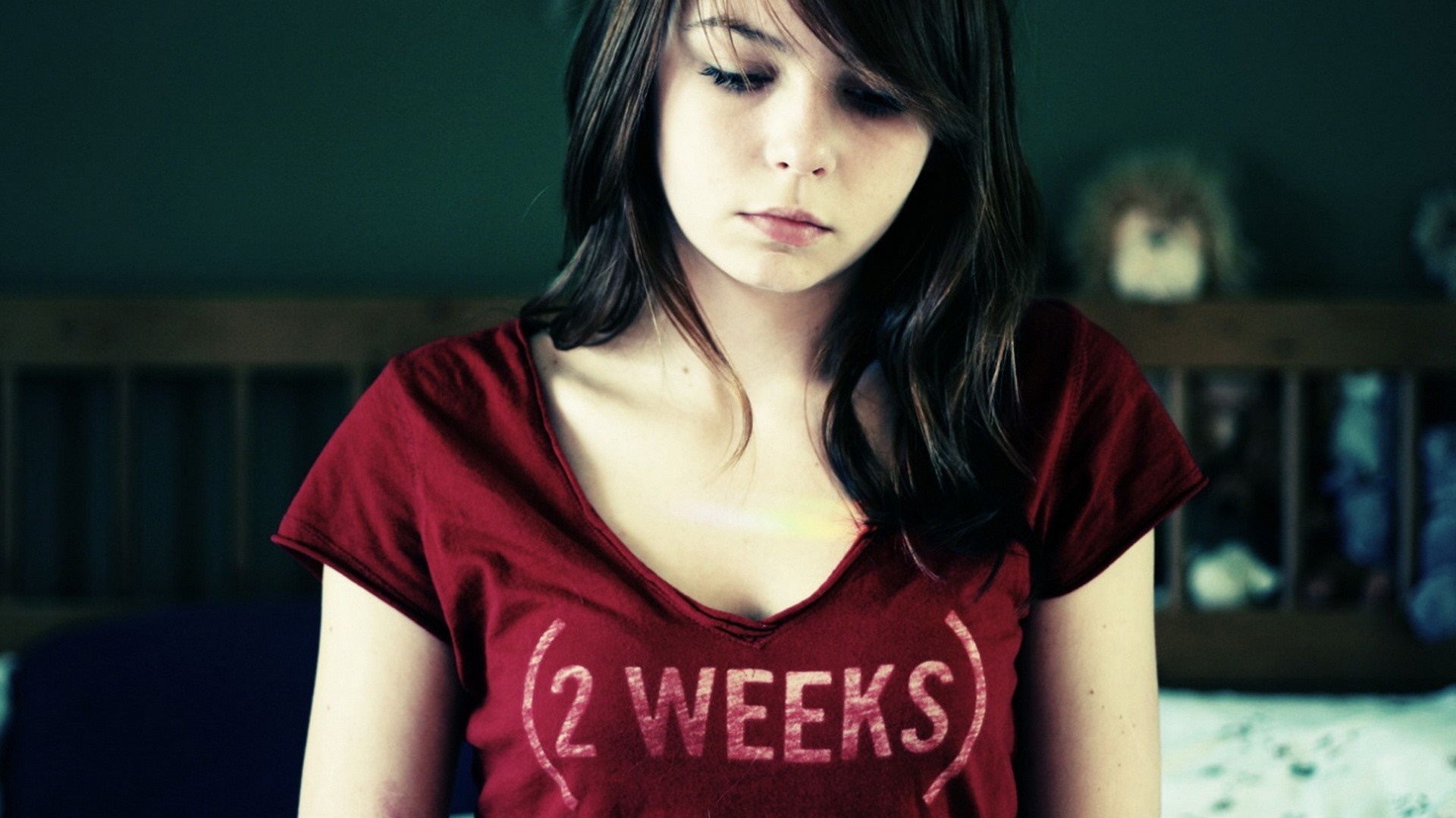 Young woman in red t-shirt with "2 WEEKS" text HD Wallpaper