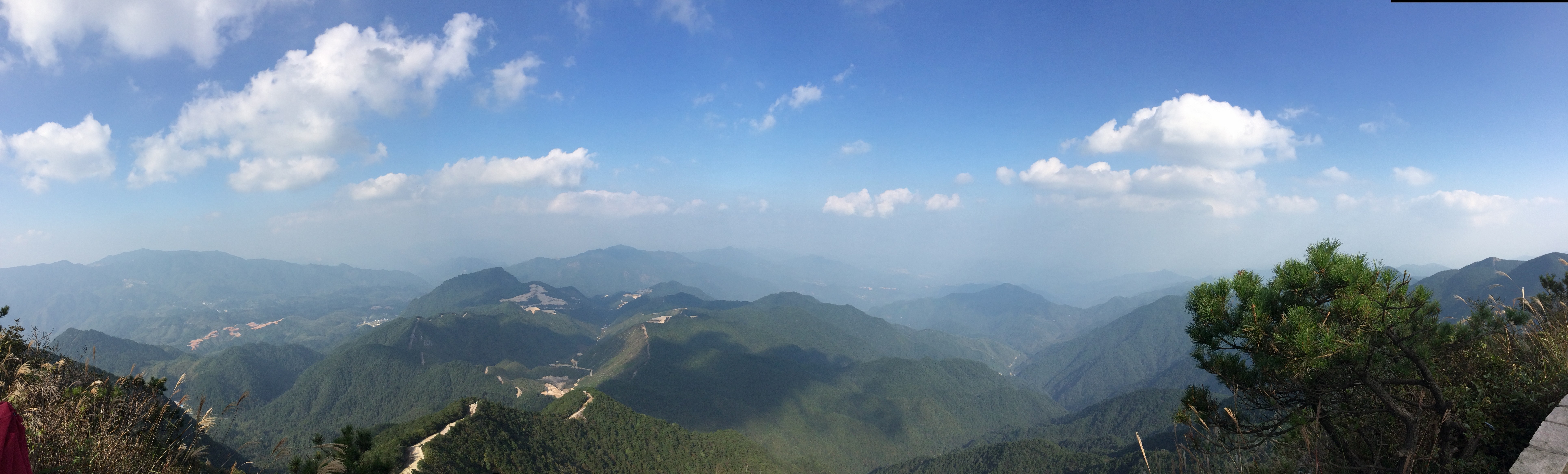 Panoramic view of mountains and valleys under a blue sky HD Wallpaper