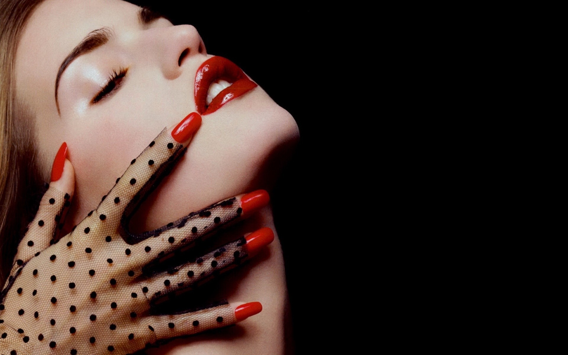 Woman with red lips and nails wearing polka dot gloves HD Wallpaper