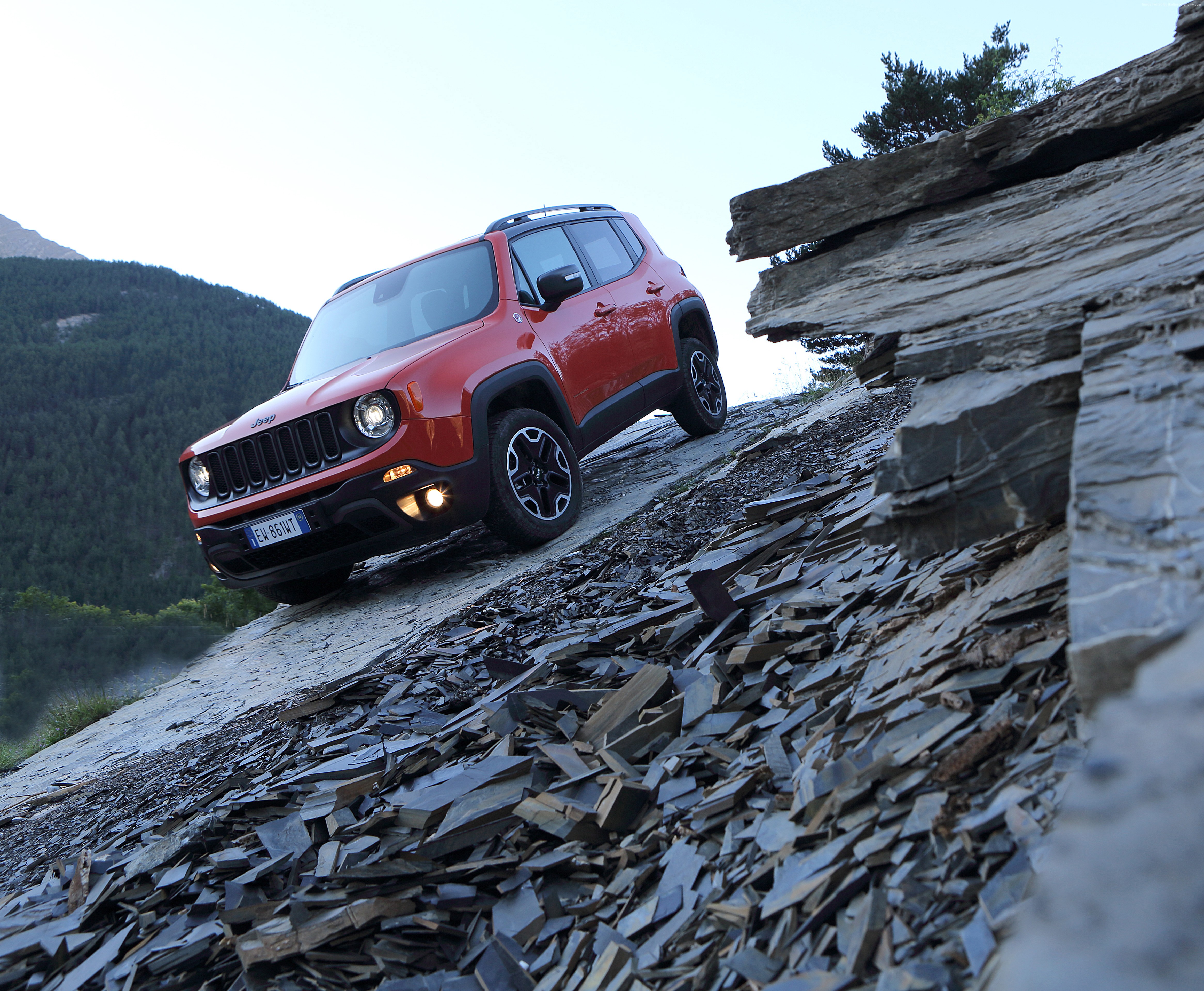 Jeep Renegade SUV driving on rocky terrain HD Wallpaper