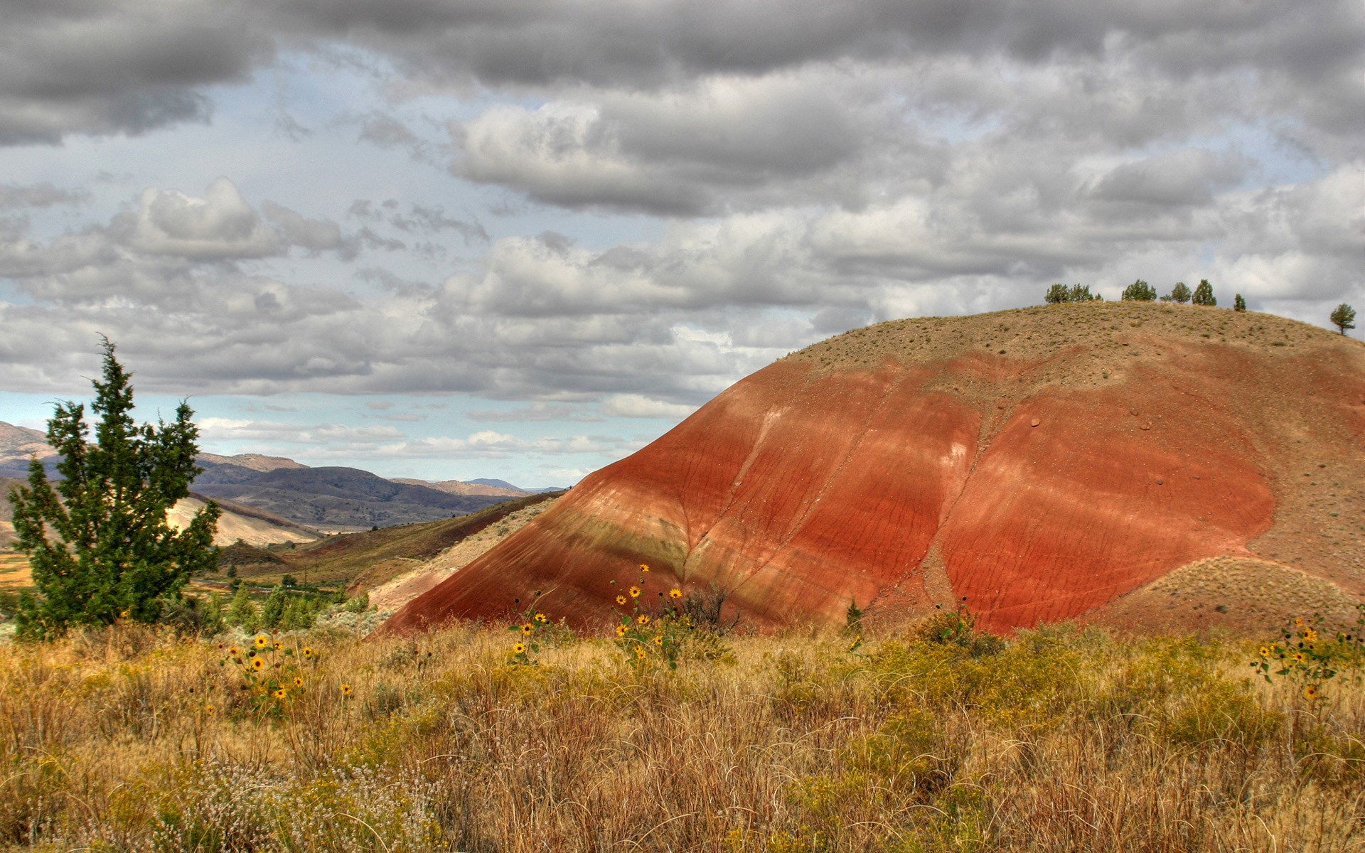 Painted Hills landscape with cloudy sky HD Wallpaper