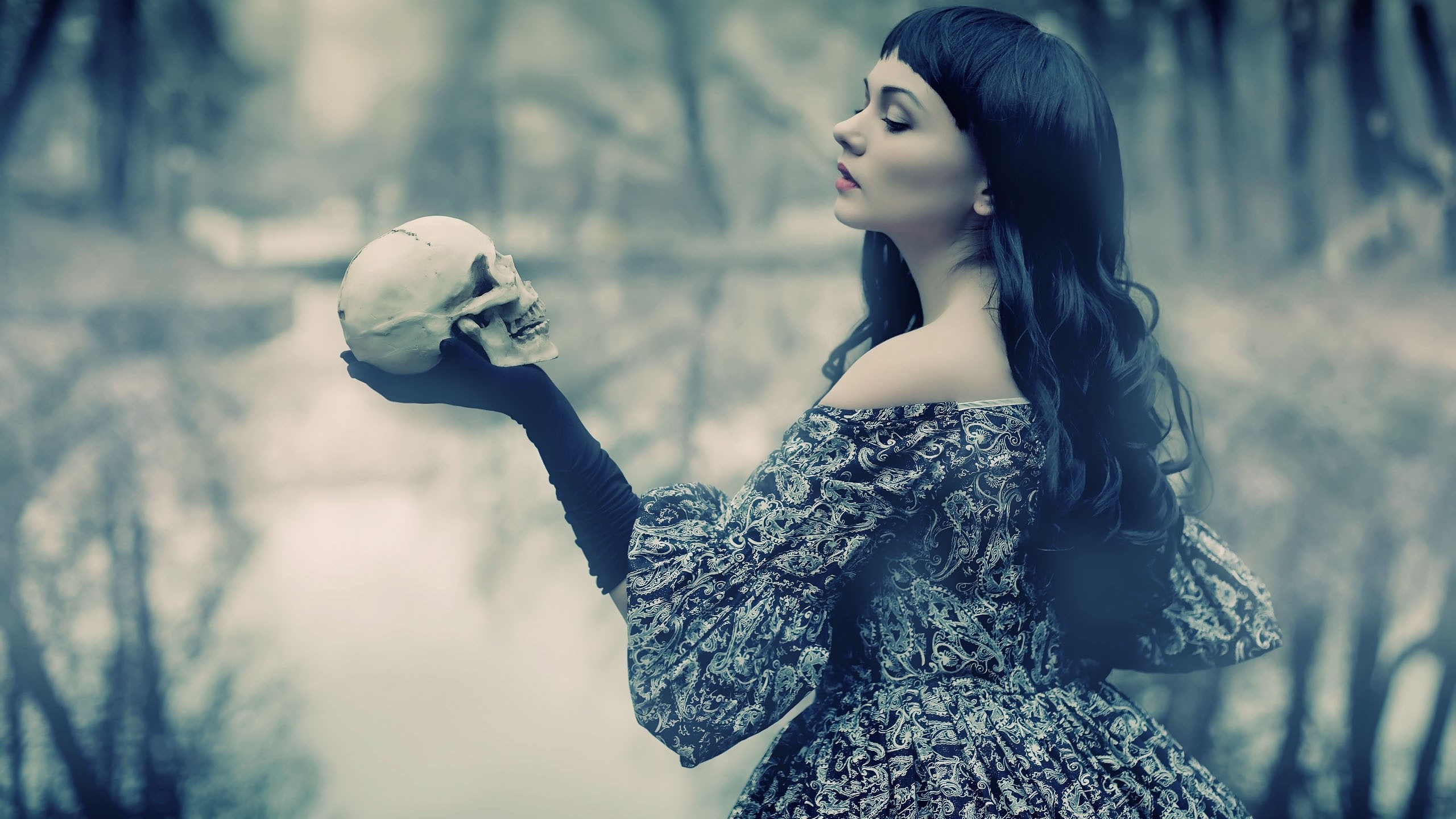 Woman in dress holding a skull HD Wallpaper