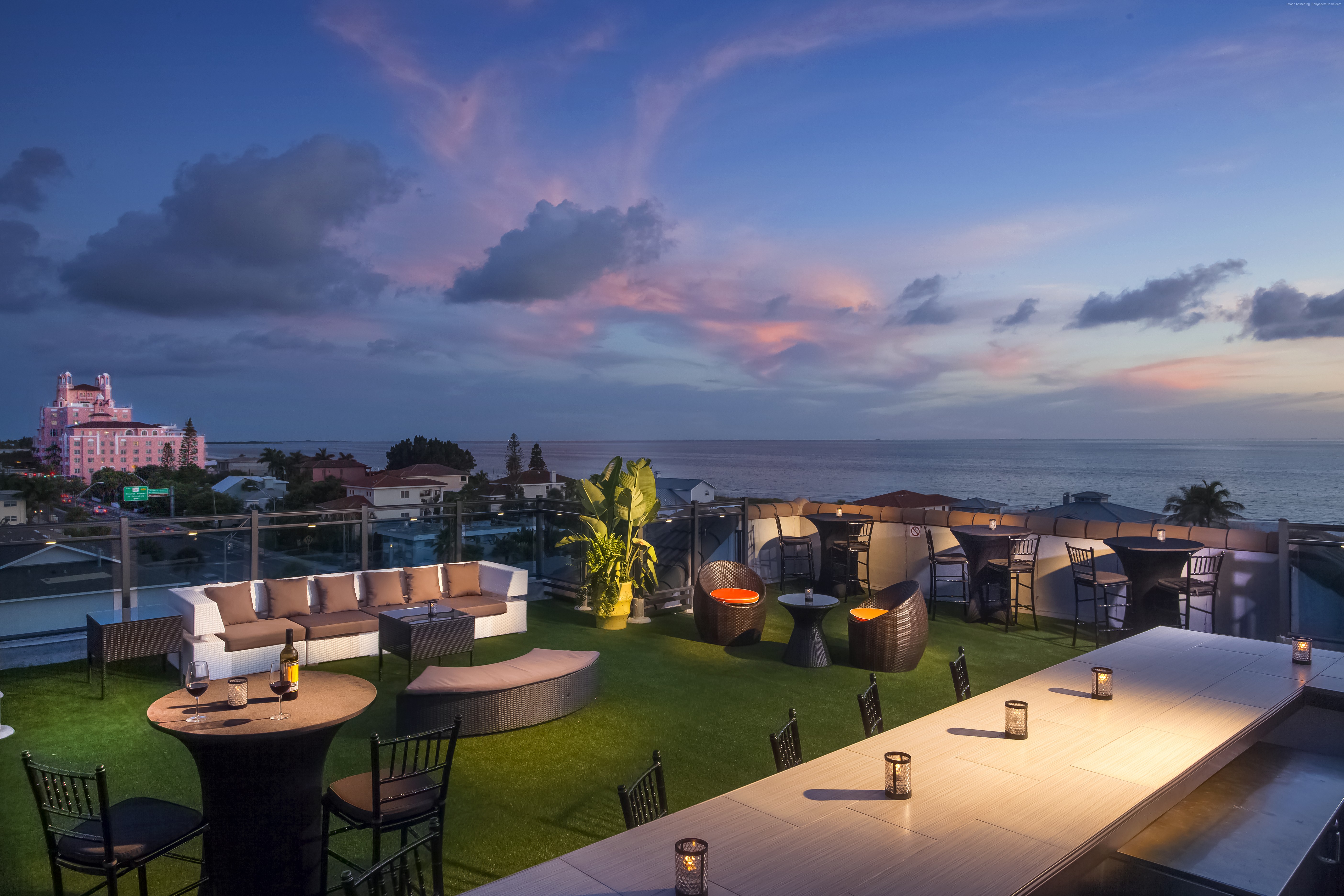 Rooftop bar at Hotel Zamora overlooking the ocean at sunset HD Wallpaper