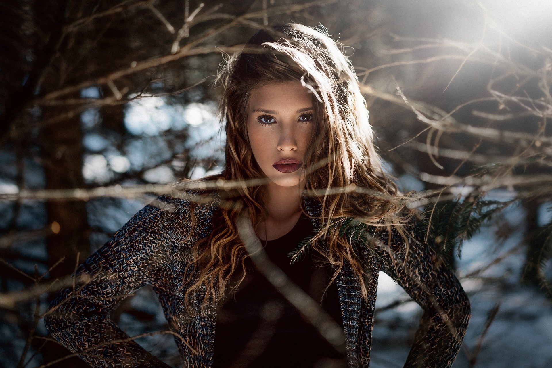 Woman with long curly hair in a forest HD Wallpaper