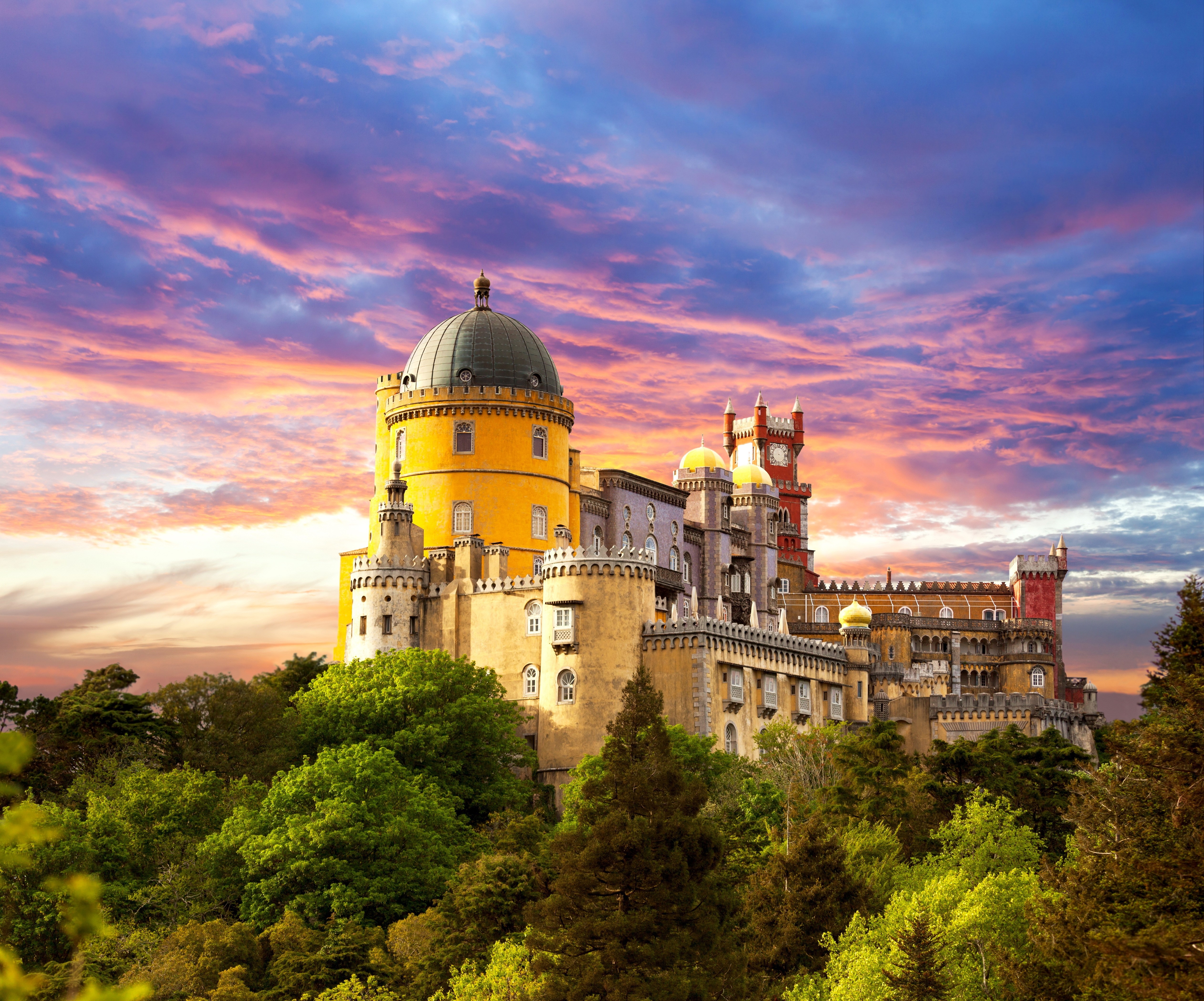 Pena Palace castle at sunset with colorful clouds HD Wallpaper