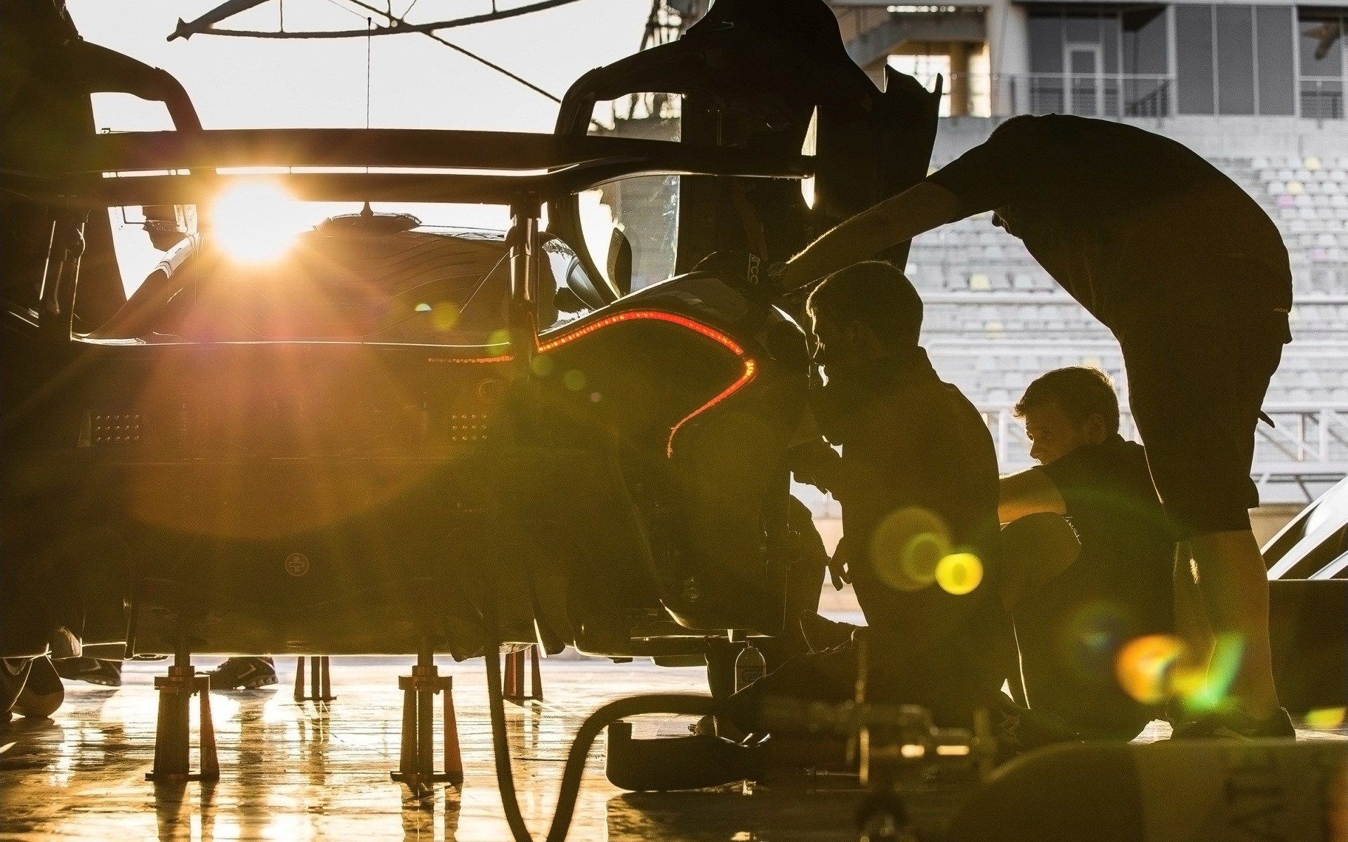 McLaren P1 GTR being worked on by mechanics HD Wallpaper