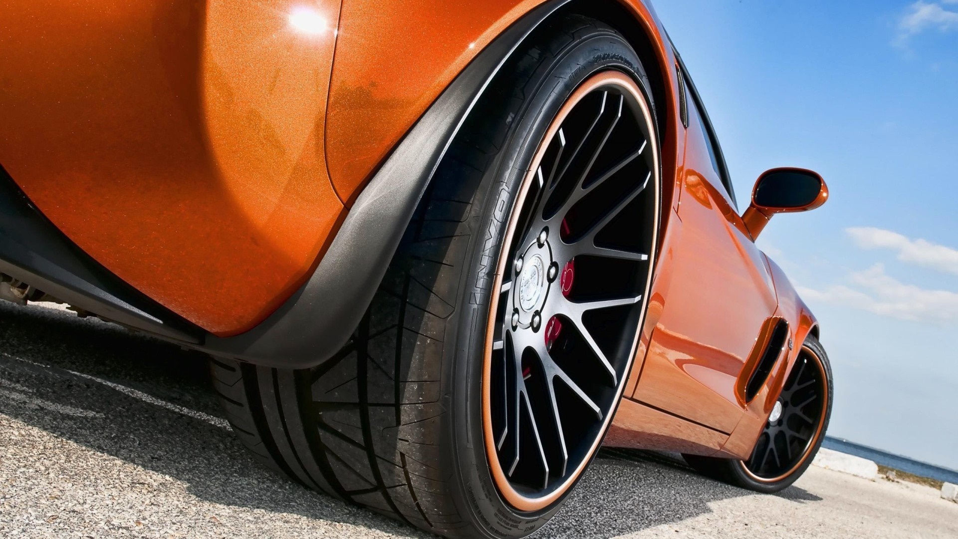 Orange Chevrolet Corvette Z06 sports car with custom wheels HD Wallpaper