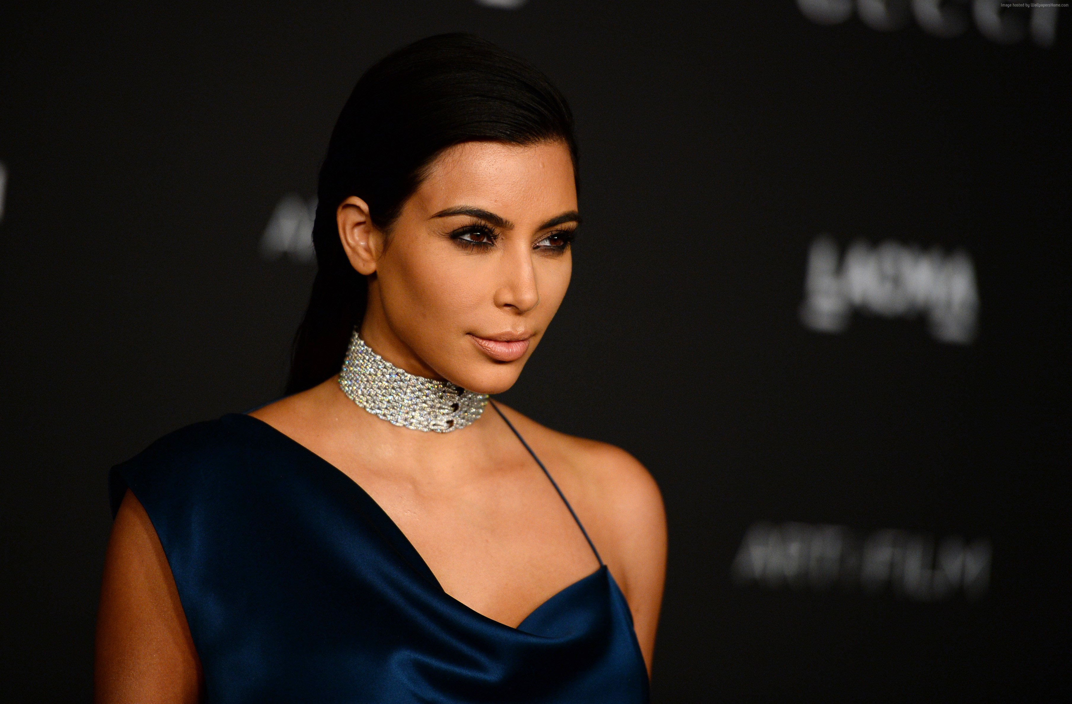 Kim Kardashian wearing a navy dress and diamond choker HD Wallpaper
