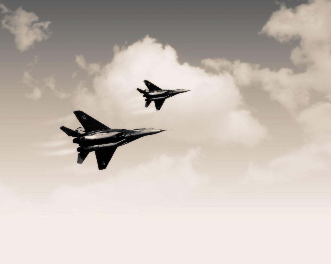Two MiG-29 fighter jets flying in formation HD Wallpaper