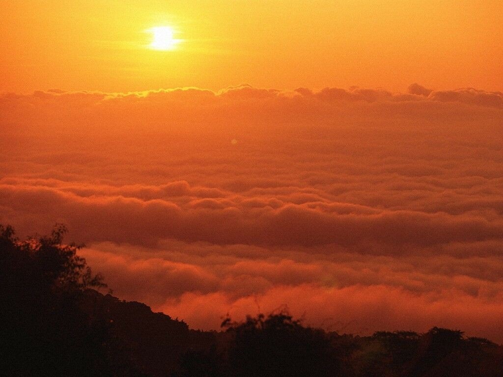 Sunrise over clouds with hill silhouette HD Wallpaper