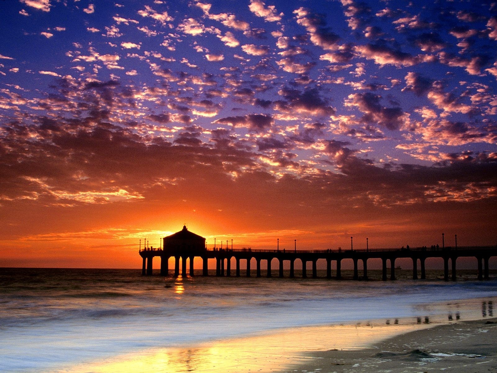 Sunset over the ocean with a pier HD Wallpaper