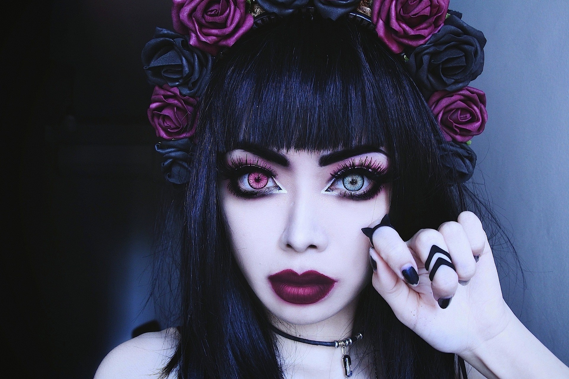 Woman with dark hair and flower crown, heterochromia eyes HD Wallpaper