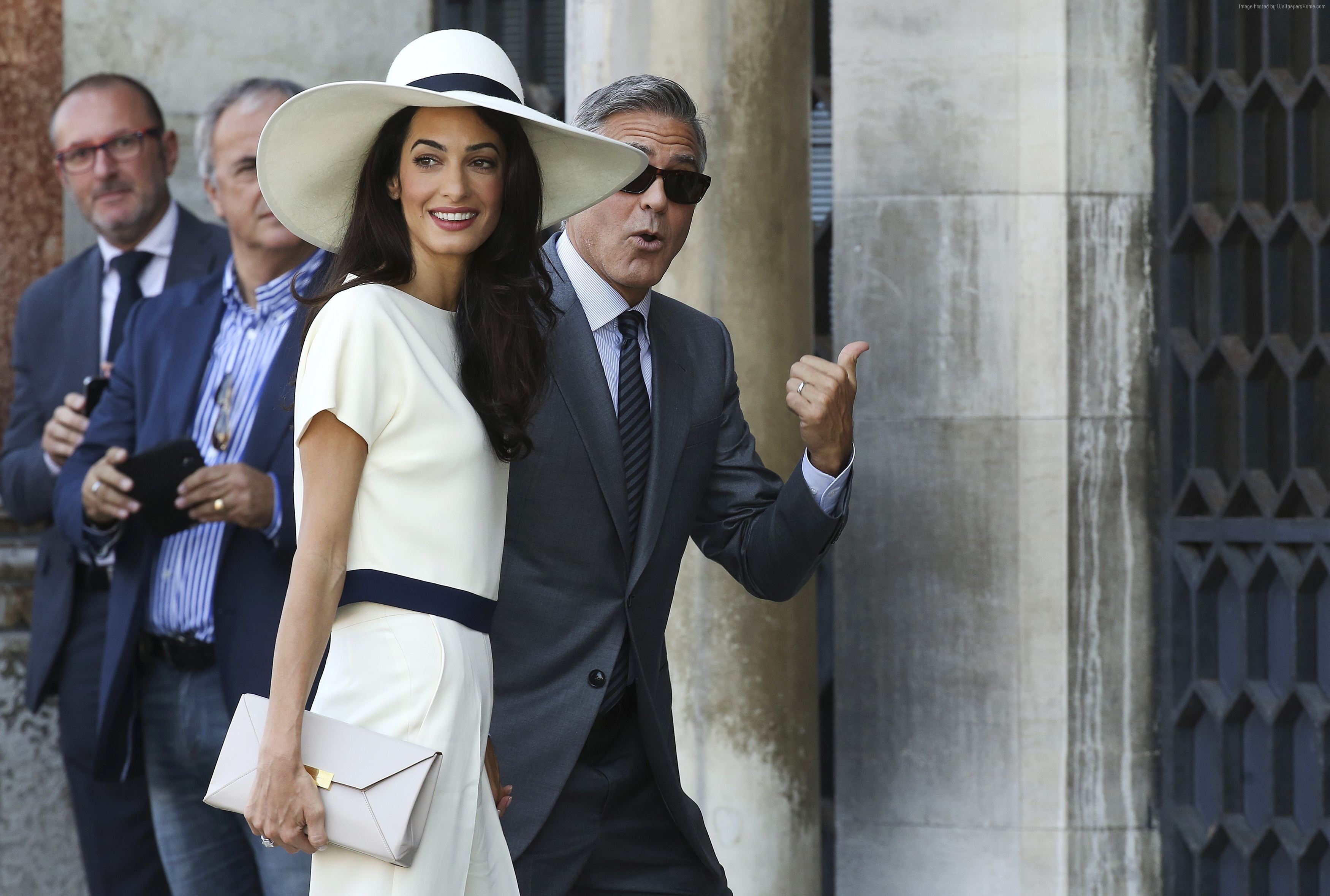 Amal Alamuddin and George Clooney at a wedding HD Wallpaper