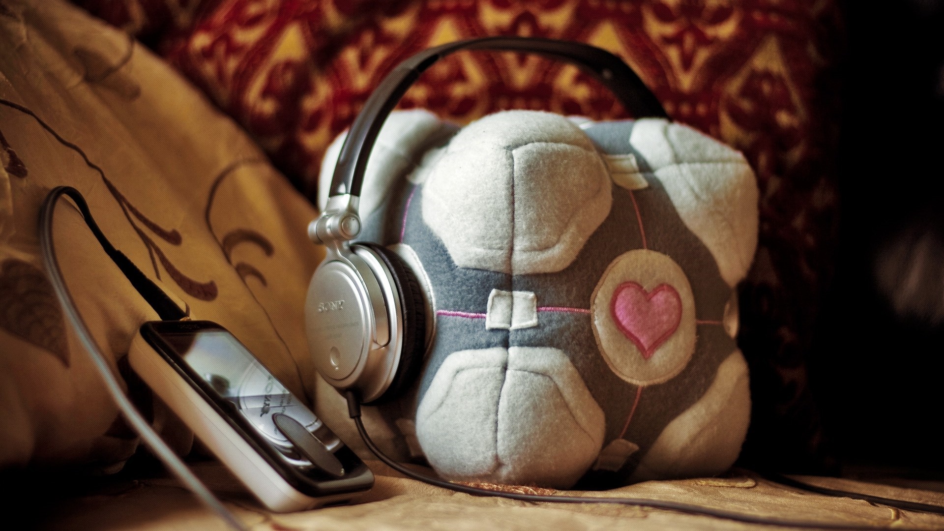 Portal Companion Cube with Headphones and MP3 Player HD Wallpaper