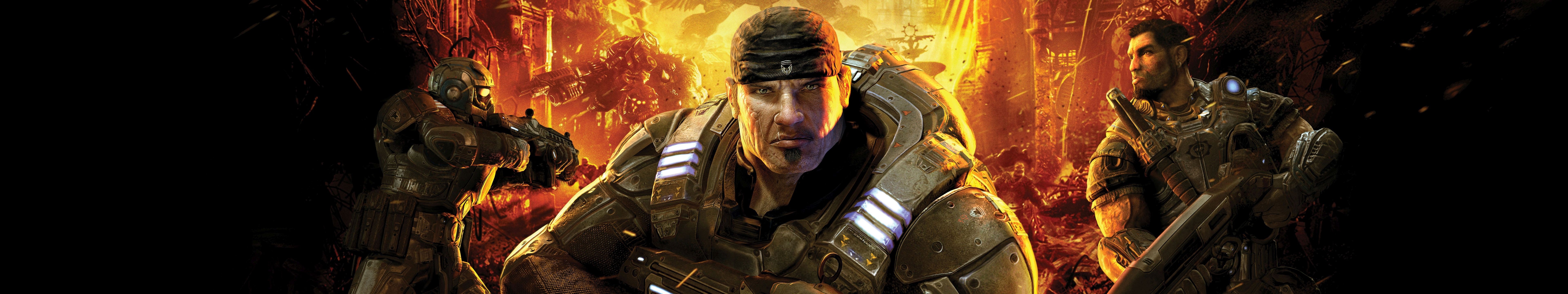 Gears of War characters in a fiery battlefield HD Wallpaper