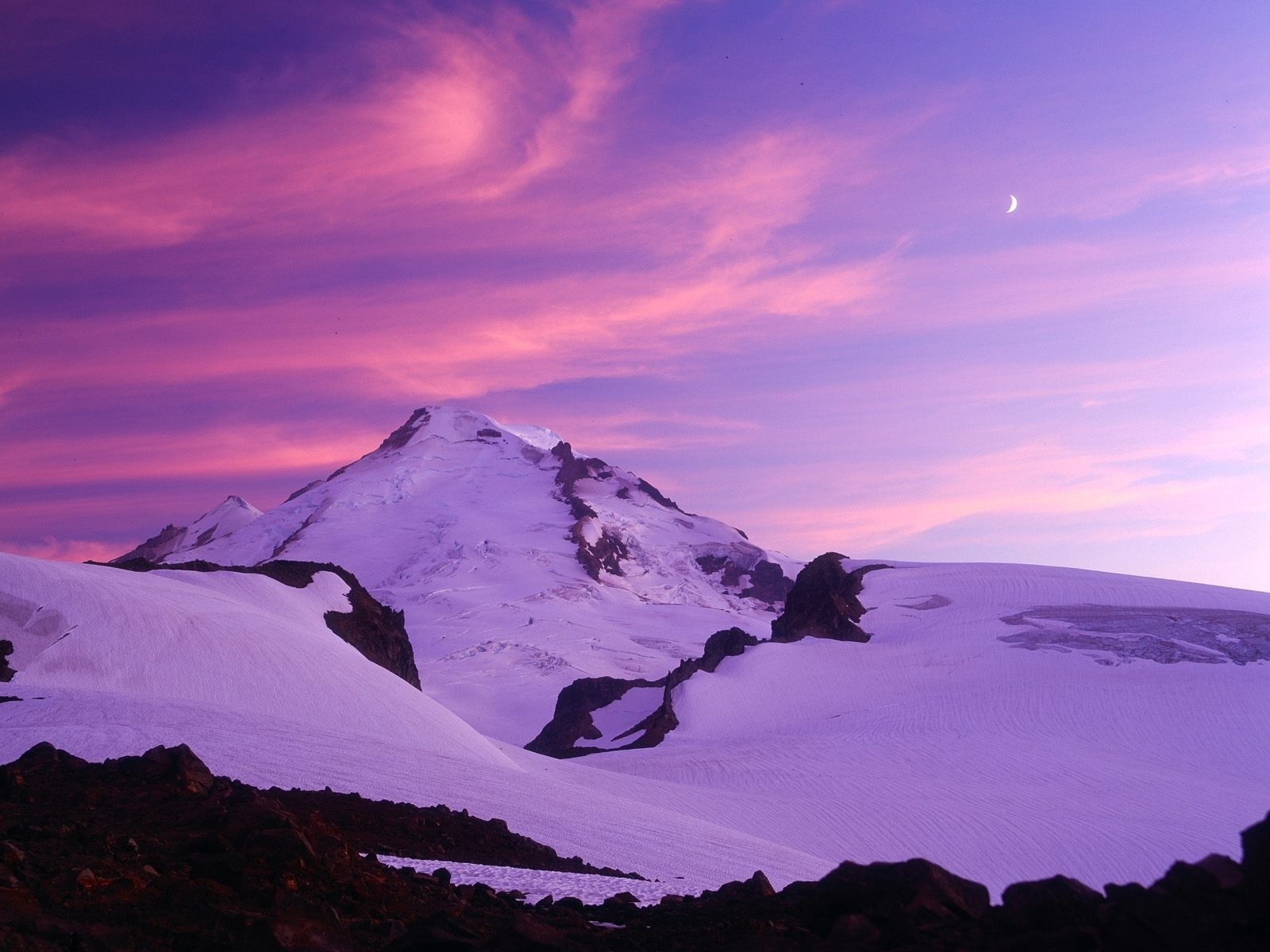 Snow-covered mountain peak at sunset with purple and pink clouds HD Wallpaper