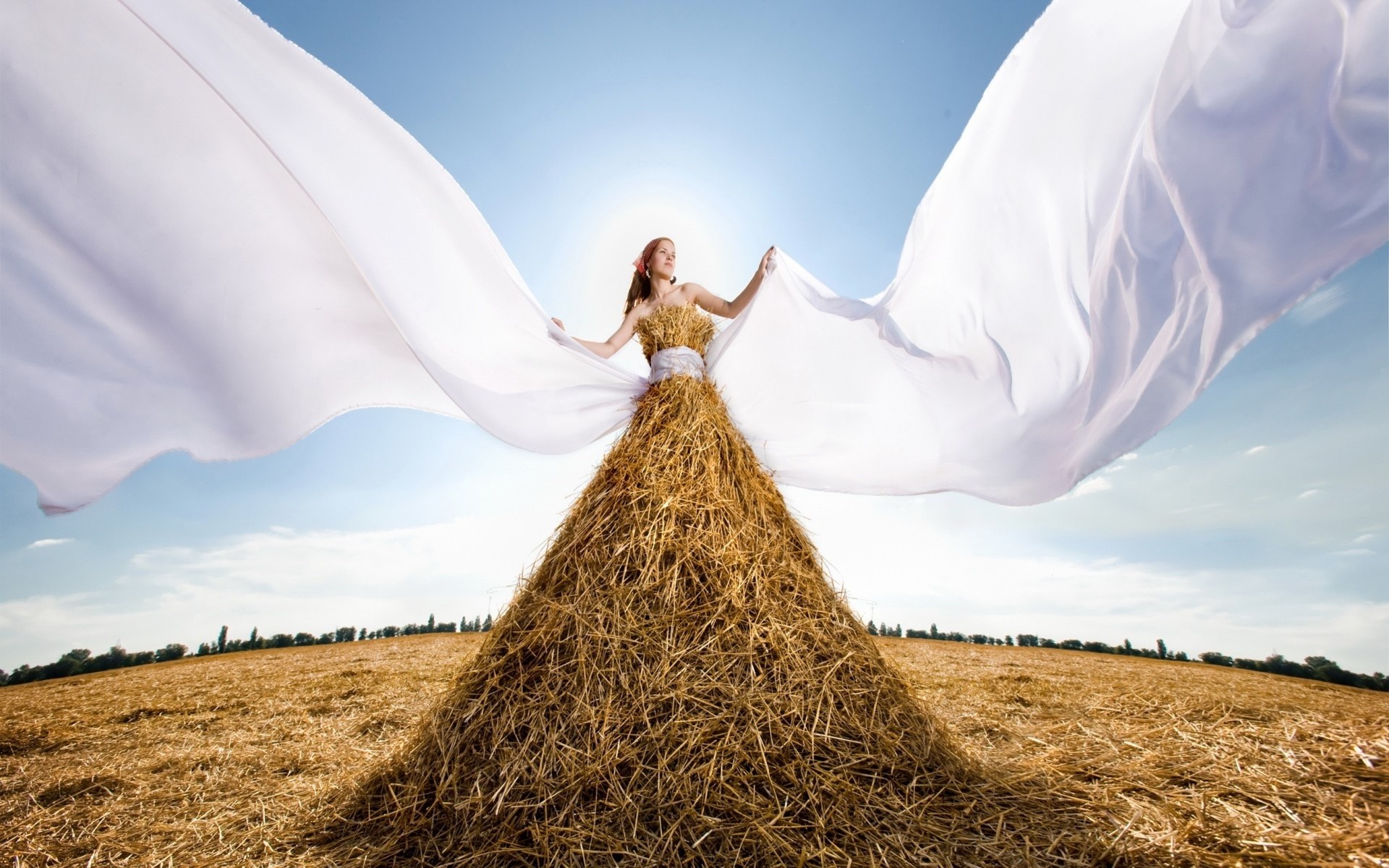 Woman in a straw dress with white fabric in a field HD Wallpaper