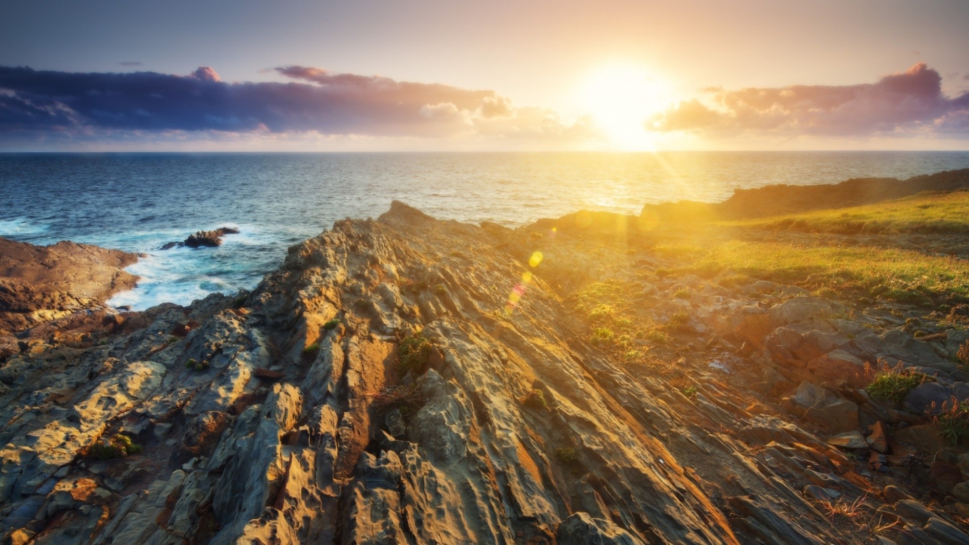 Sunset over rocky coast and ocean HD Wallpaper