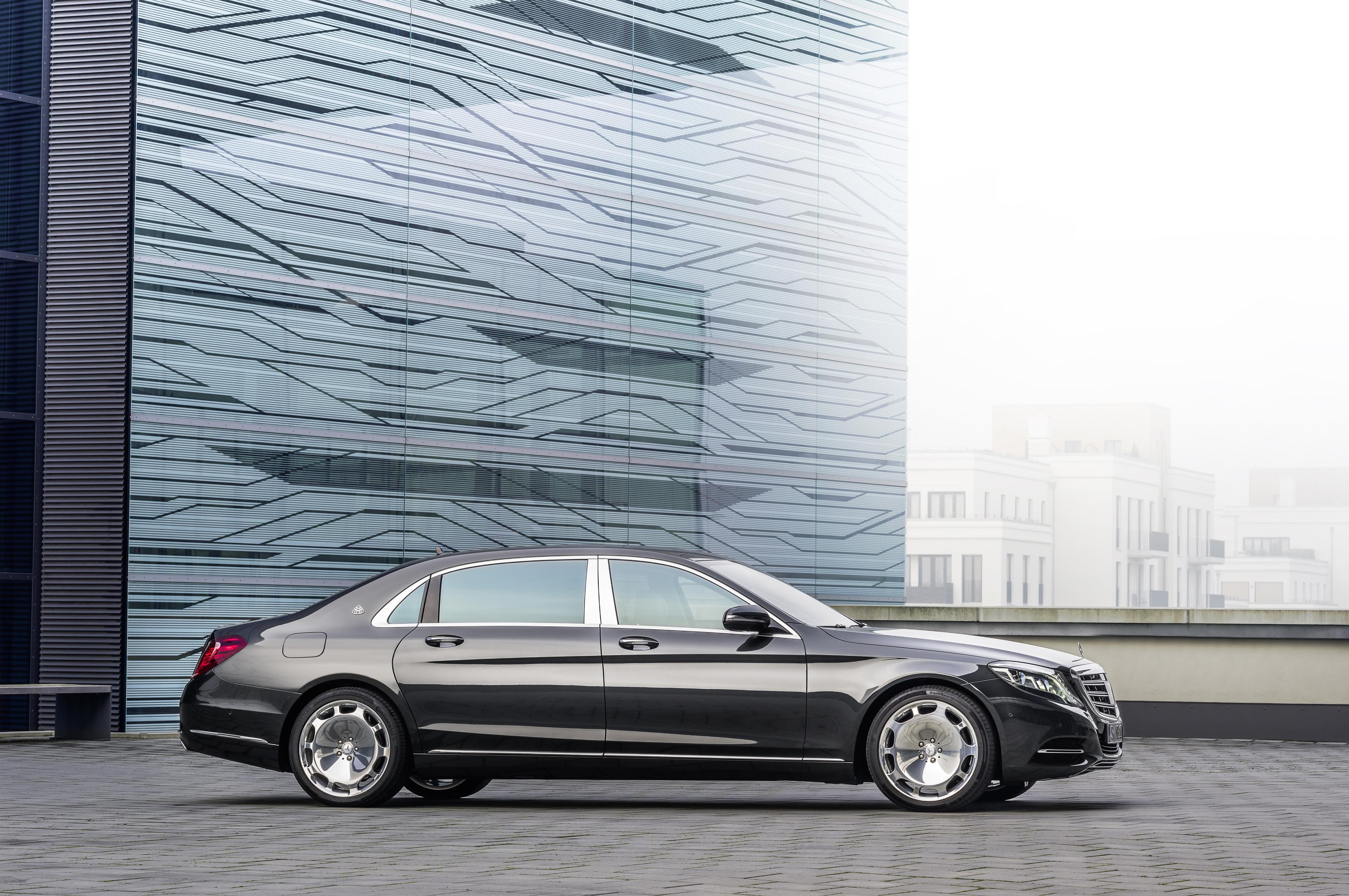 Mercedes-Maybach S600 Sedan parked in front of a modern building HD Wallpaper