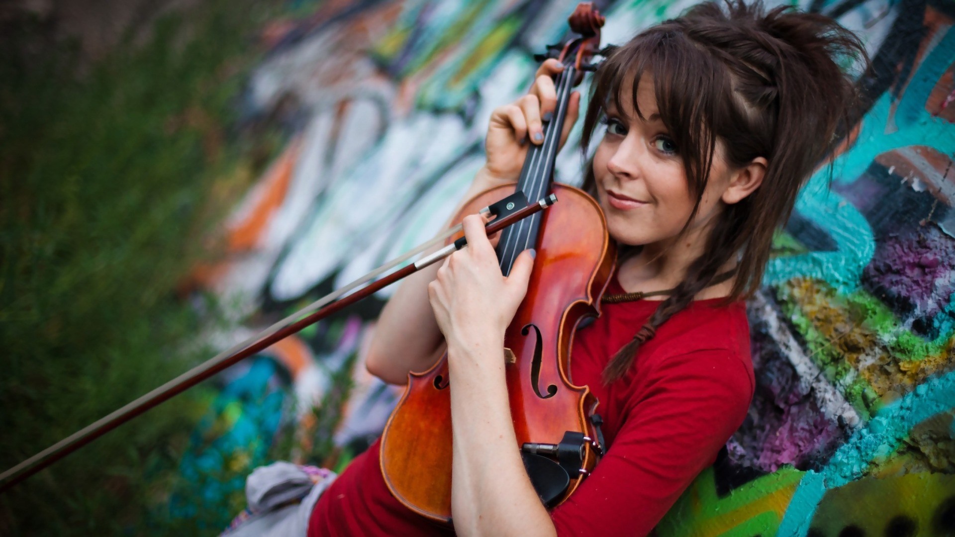 Woman holding a violin with graffiti background HD Wallpaper