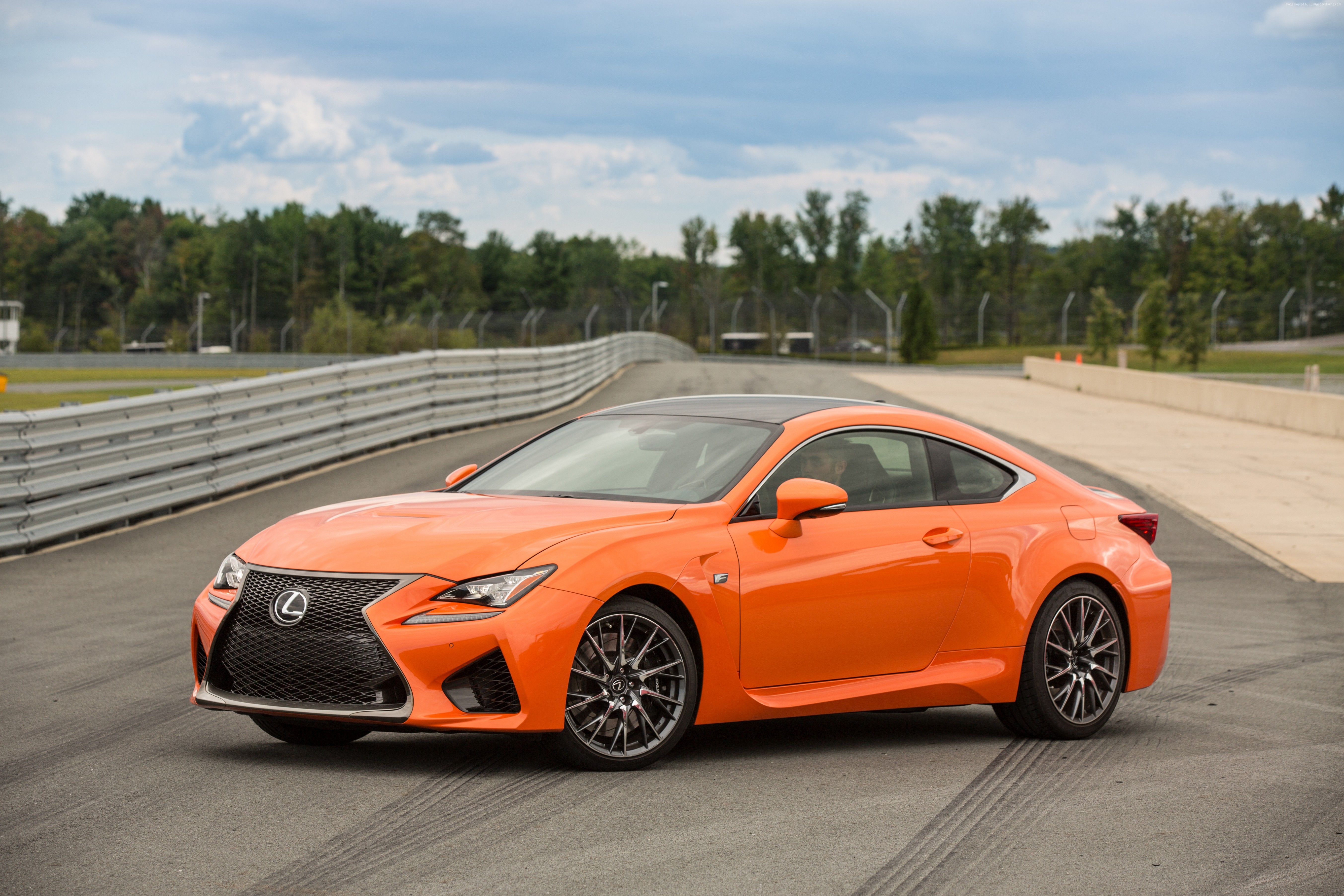 Orange Lexus RC F sports car on a race track HD Wallpaper