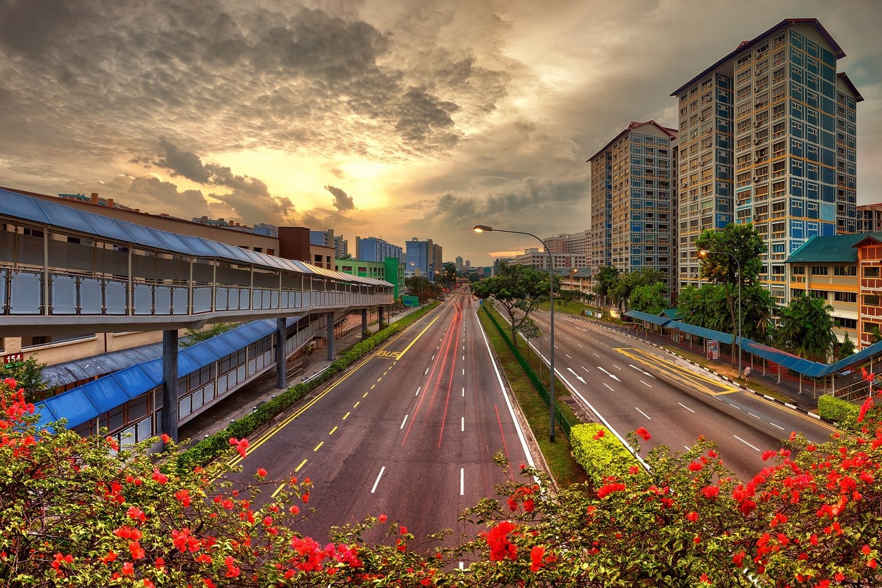 Cityscape with highway and buildings at sunset HD Wallpaper