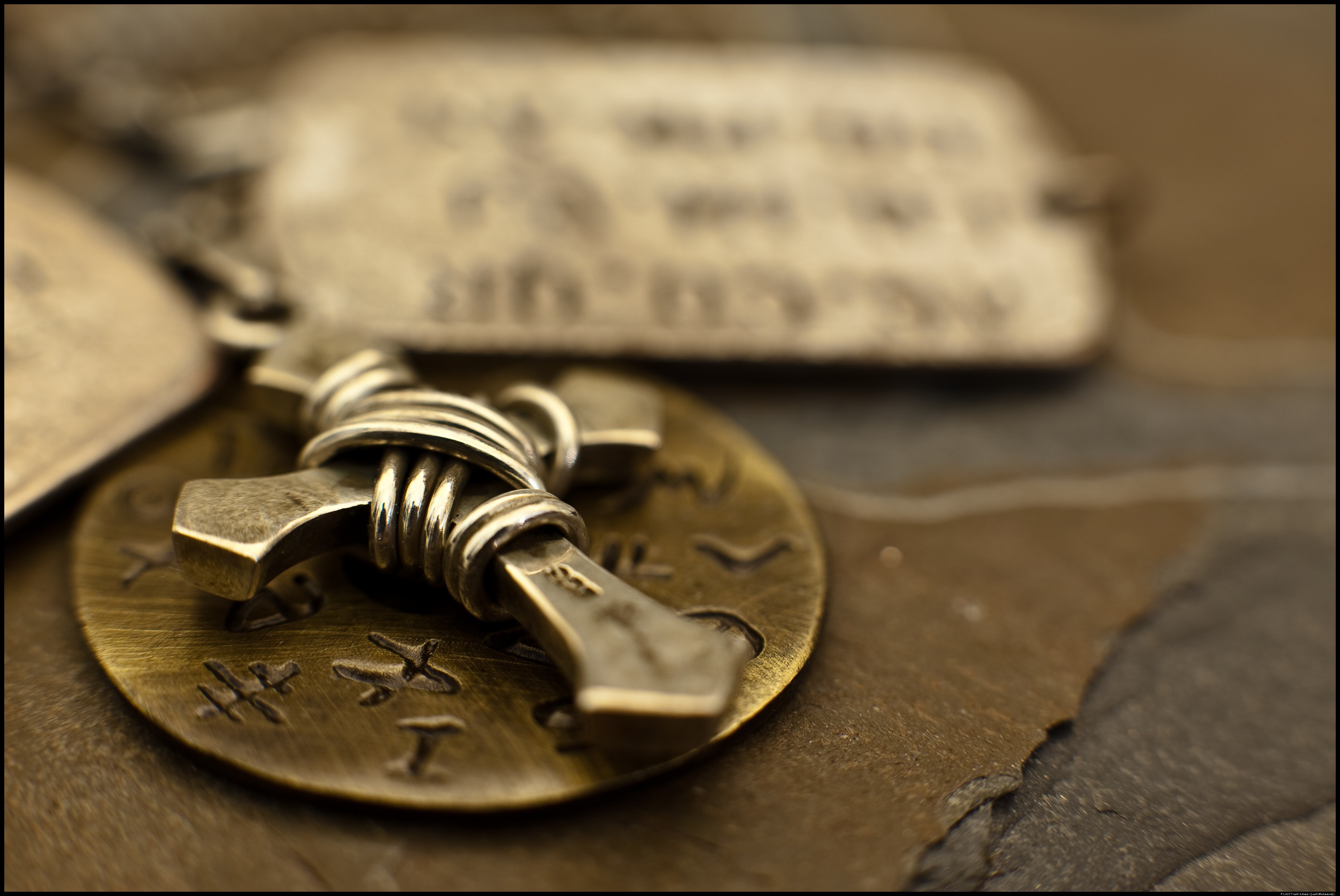 Close up of a metal cross on a coin HD Wallpaper