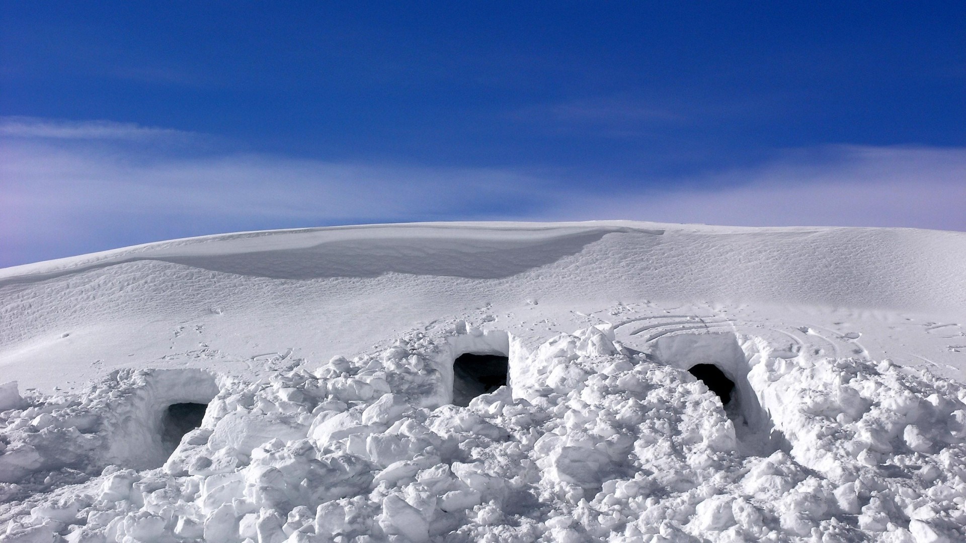 Snowy landscape with openings in the snow HD Wallpaper
