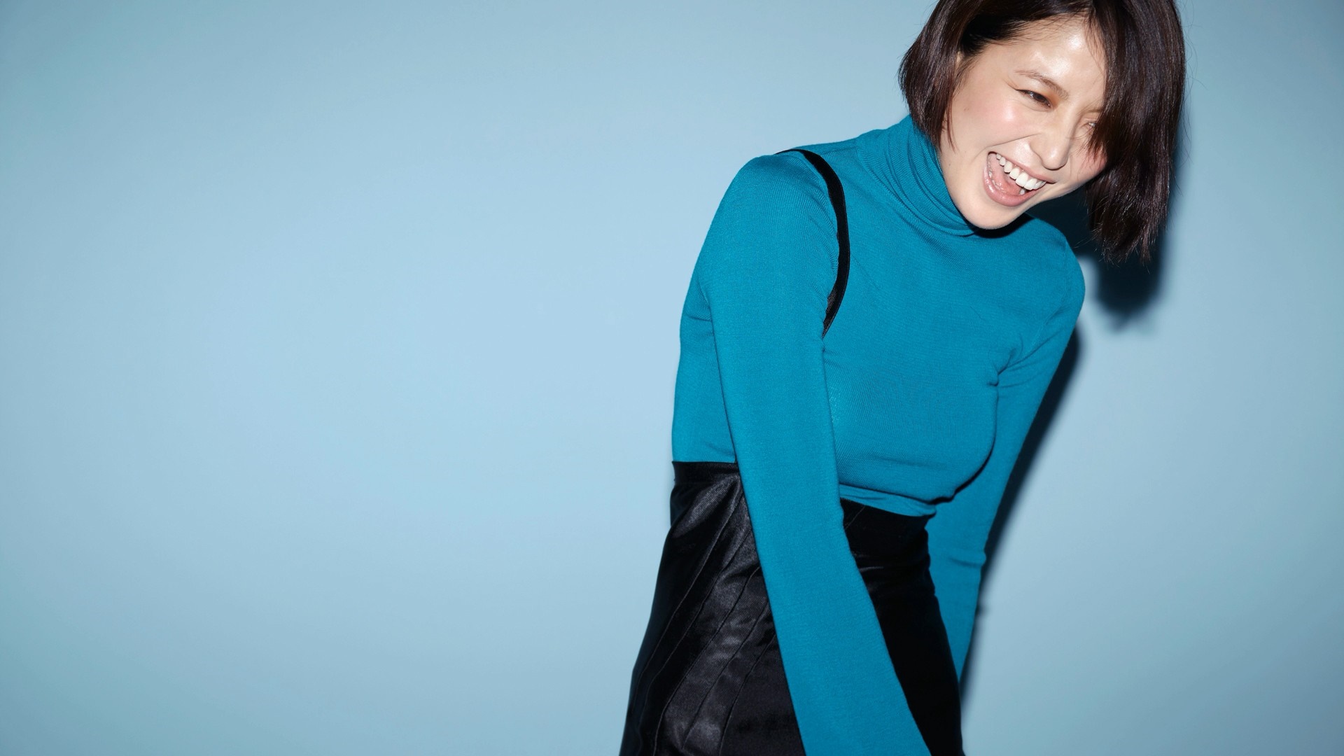 Masami Nagasawa laughing in a blue turtleneck and black skirt HD Wallpaper