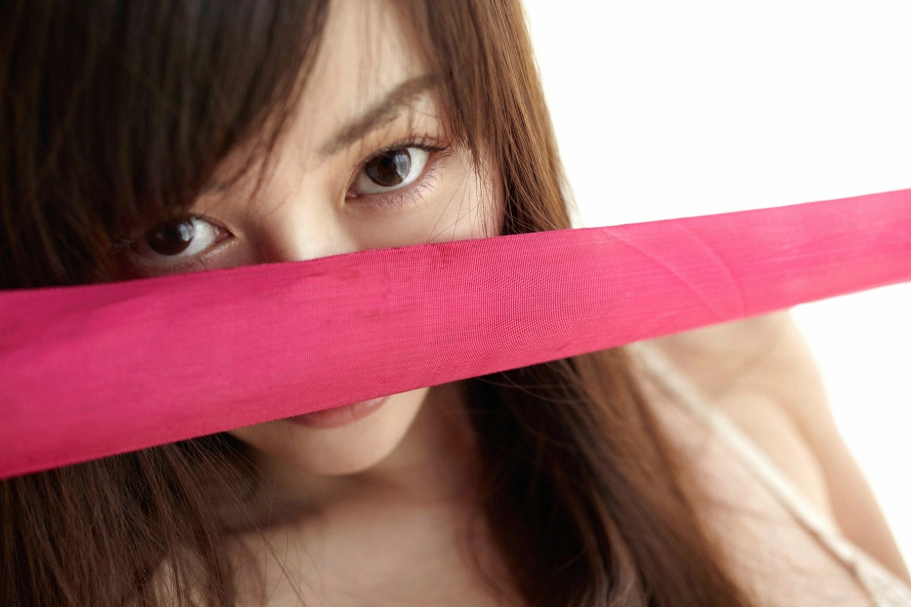 Close-up of a woman's face with pink fabric HD Wallpaper