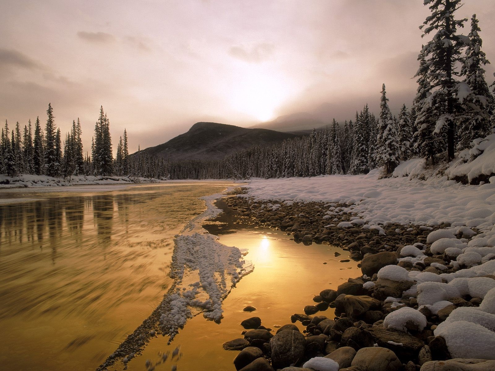 Winter river landscape at sunset with snow-covered trees and mountain HD Wallpaper