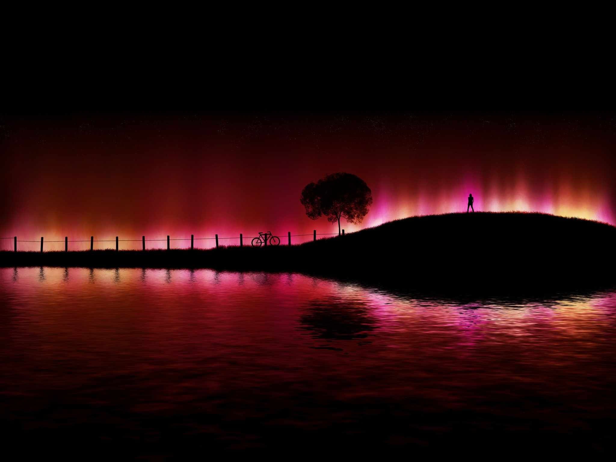 Silhouette of a person on a hill with aurora borealis over water HD Wallpaper