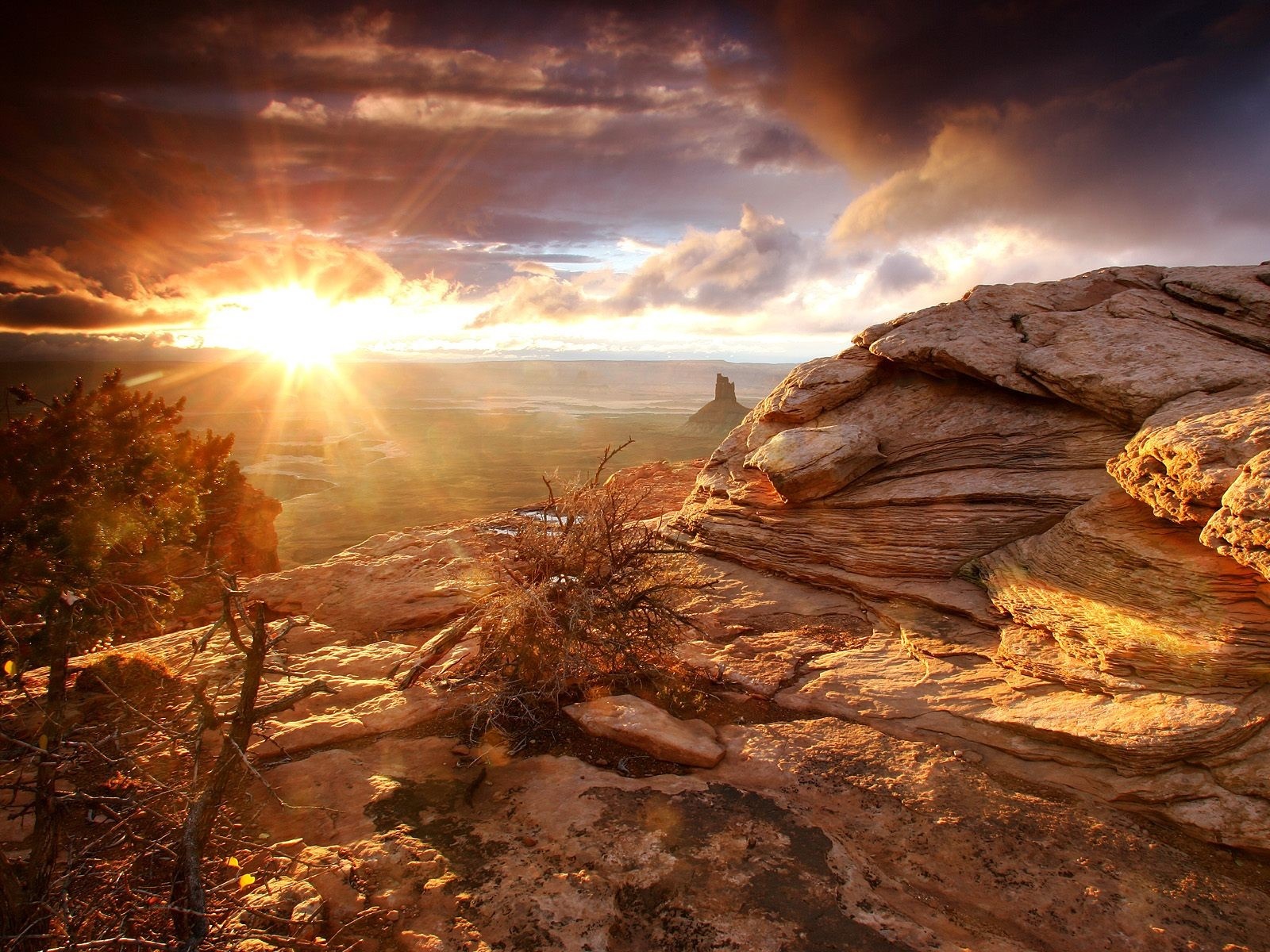 Sunrise over a rocky canyon landscape HD Wallpaper