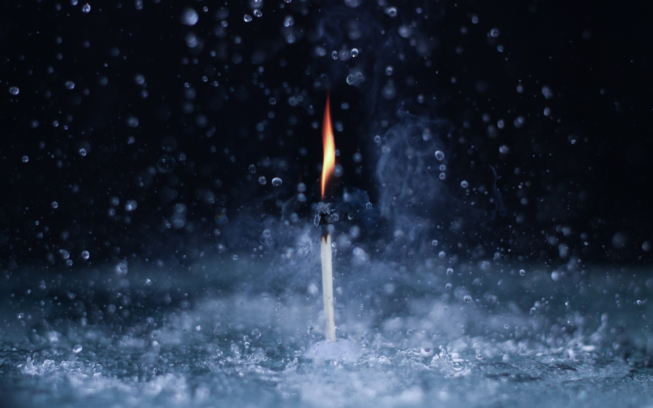 Burning match in water with rain drops HD Wallpaper
