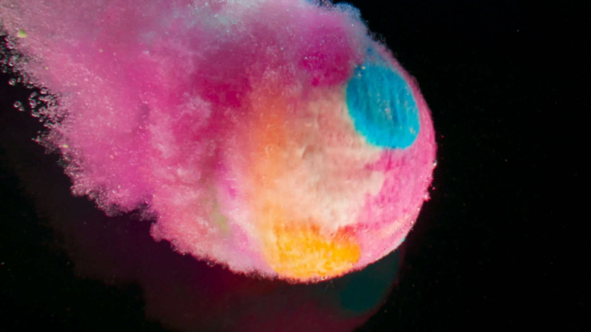 Colorful powder explosion with pink and blue hues HD Wallpaper