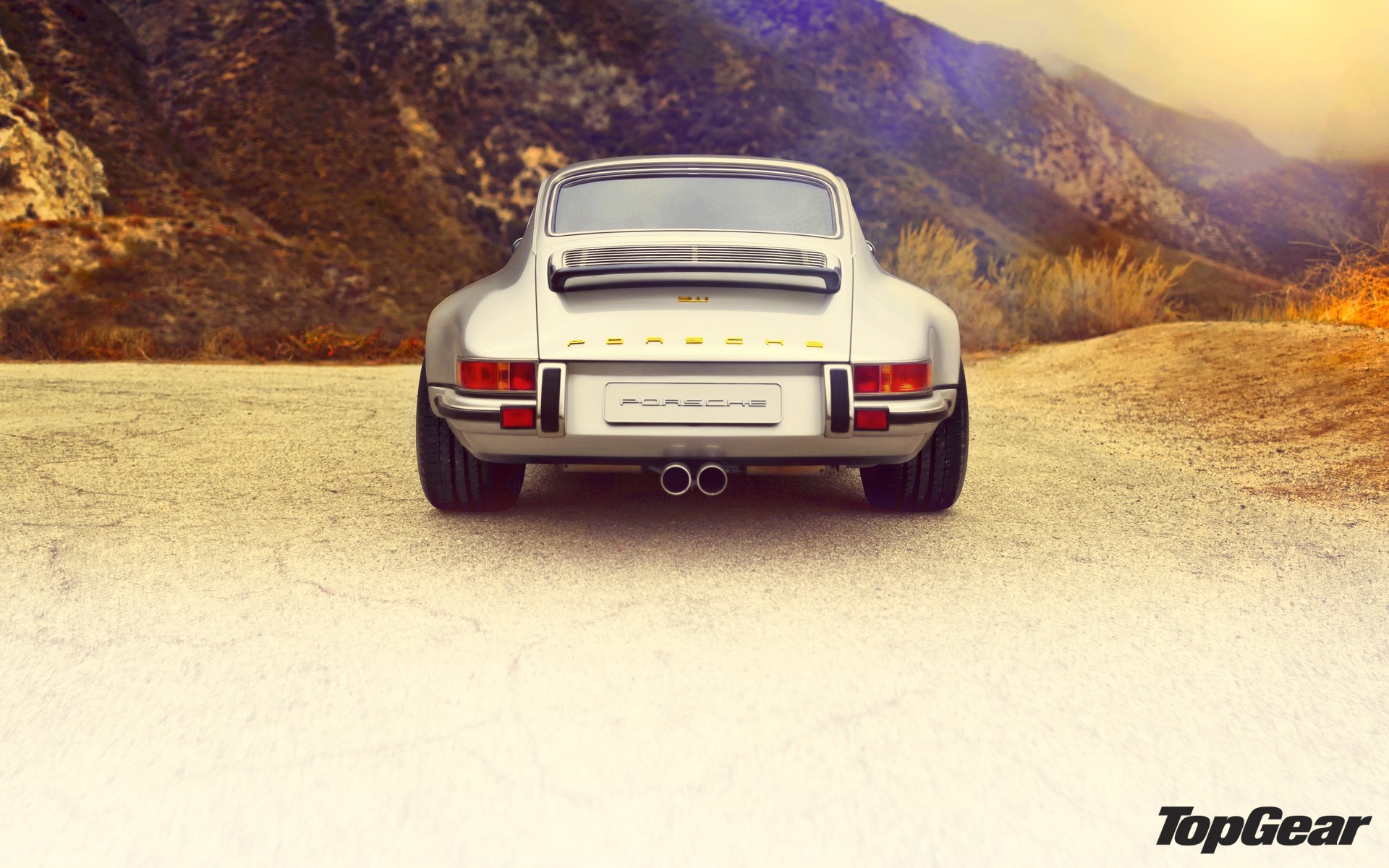 Rear view of a silver Porsche 911 sports car HD Wallpaper