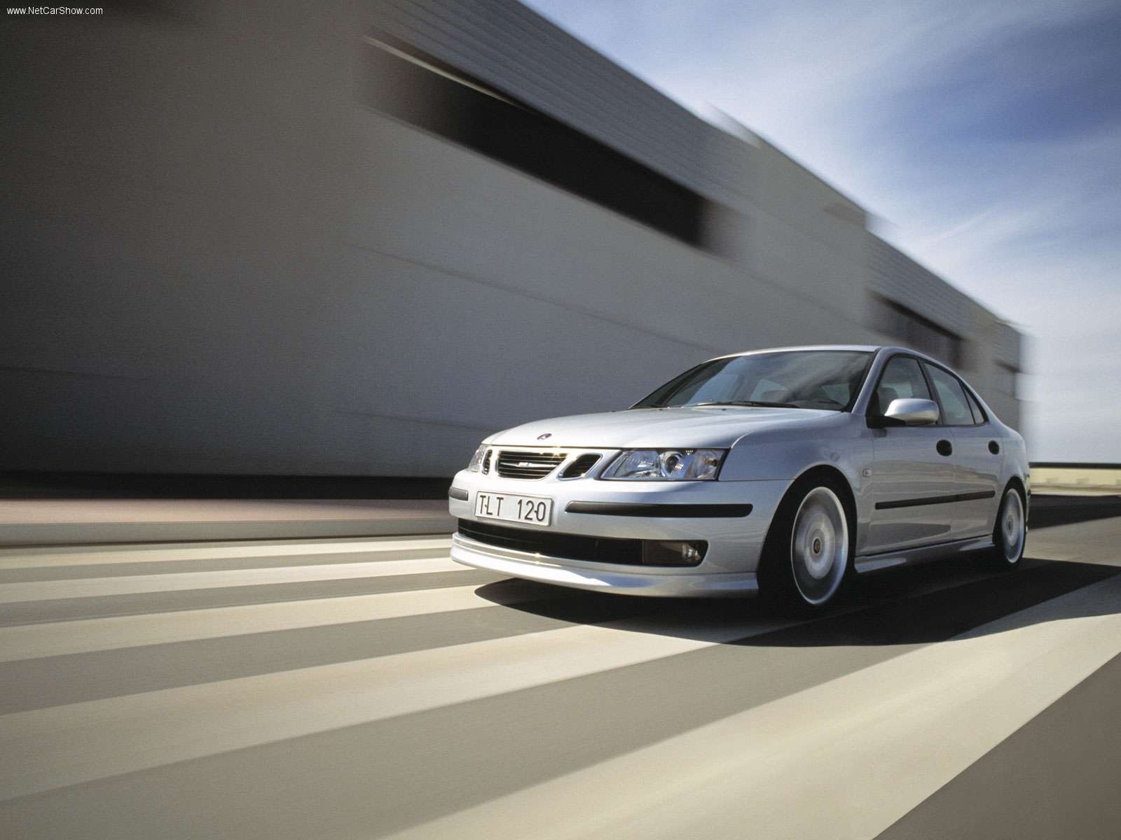 Silver Saab 9-3 Sedan driving on a road HD Wallpaper
