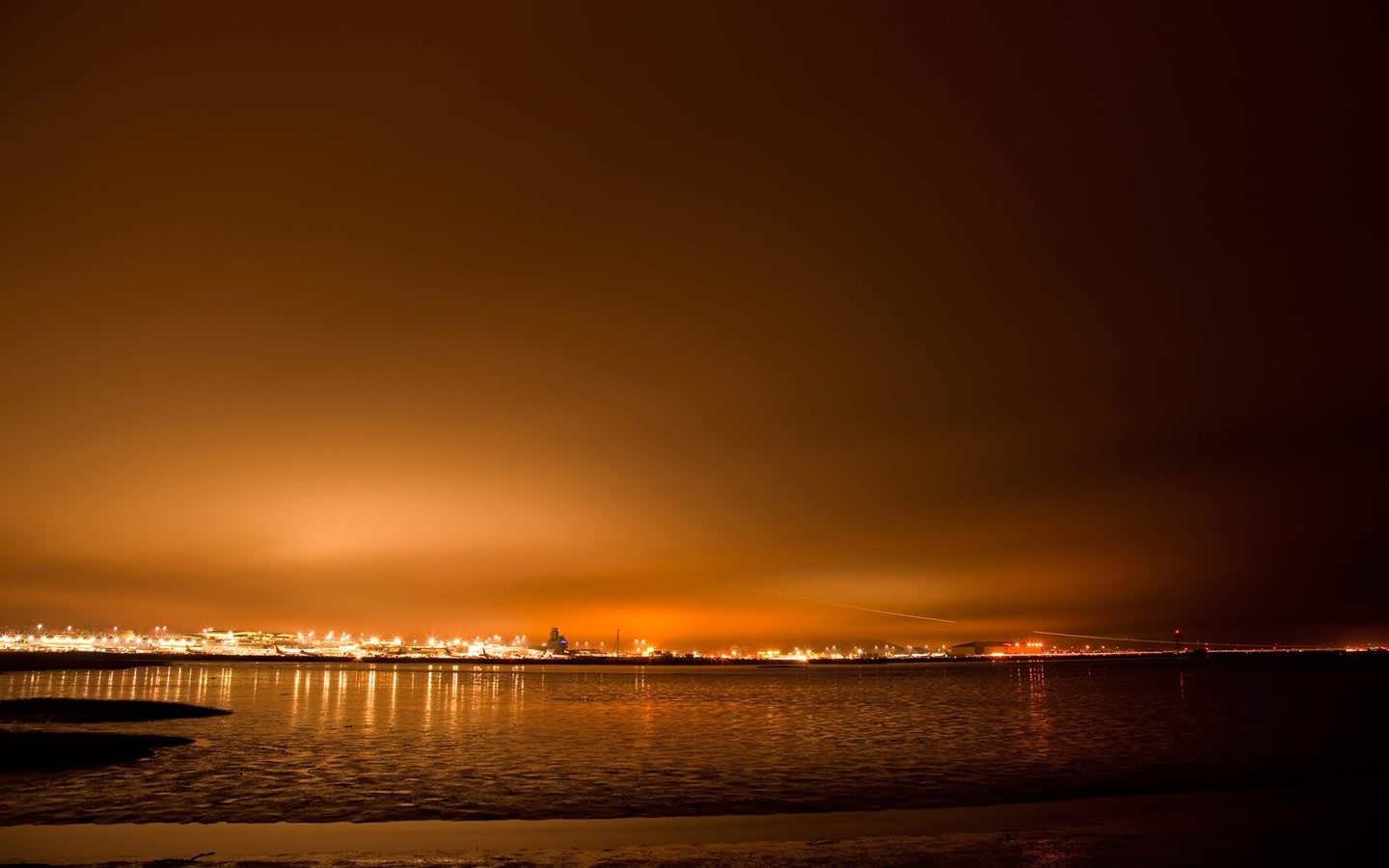 City lights reflecting on the water at dusk HD Wallpaper