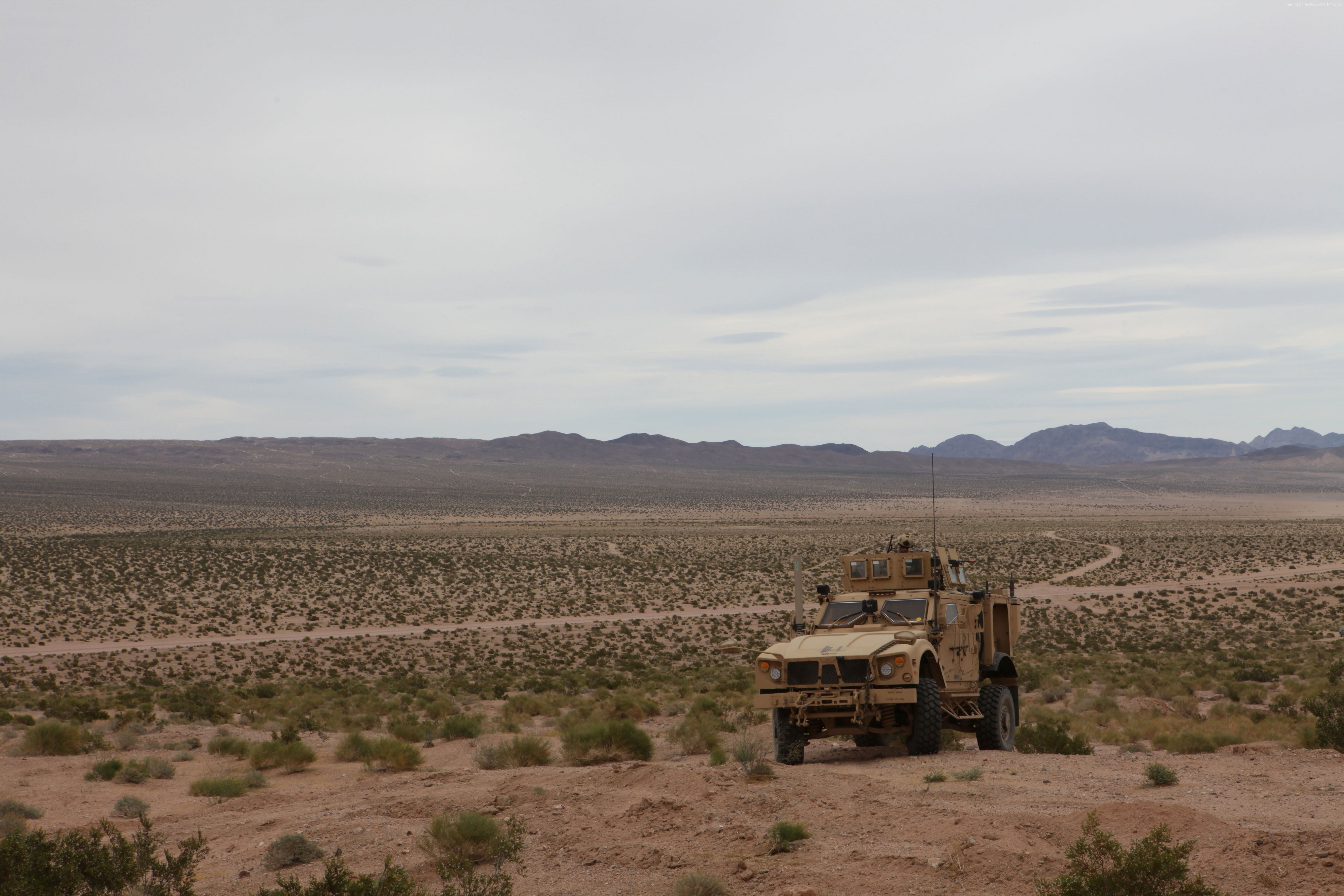 Oshkosh M-ATV in a desert landscape HD Wallpaper