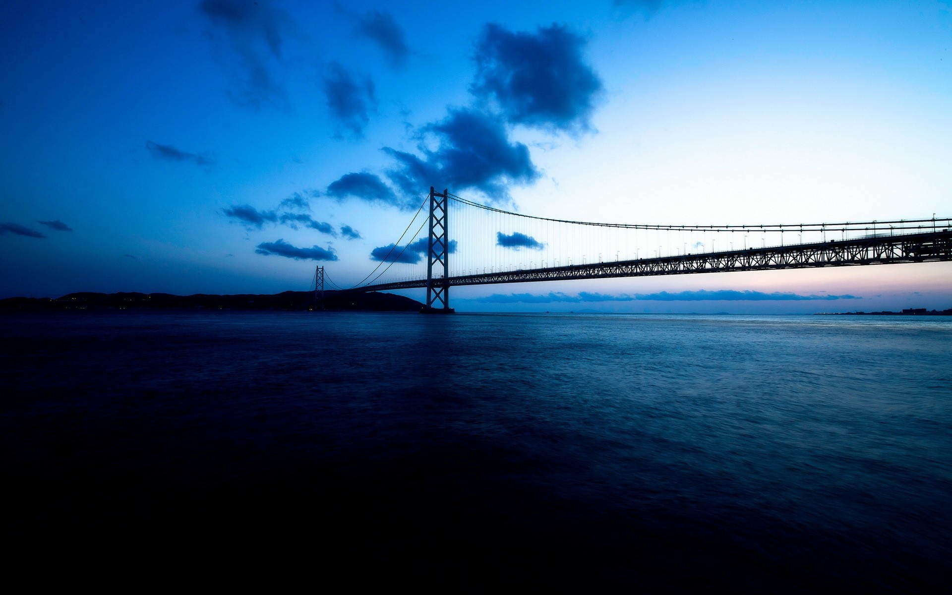 Akashi Kaikyo Bridge at dusk over the ocean HD Wallpaper
